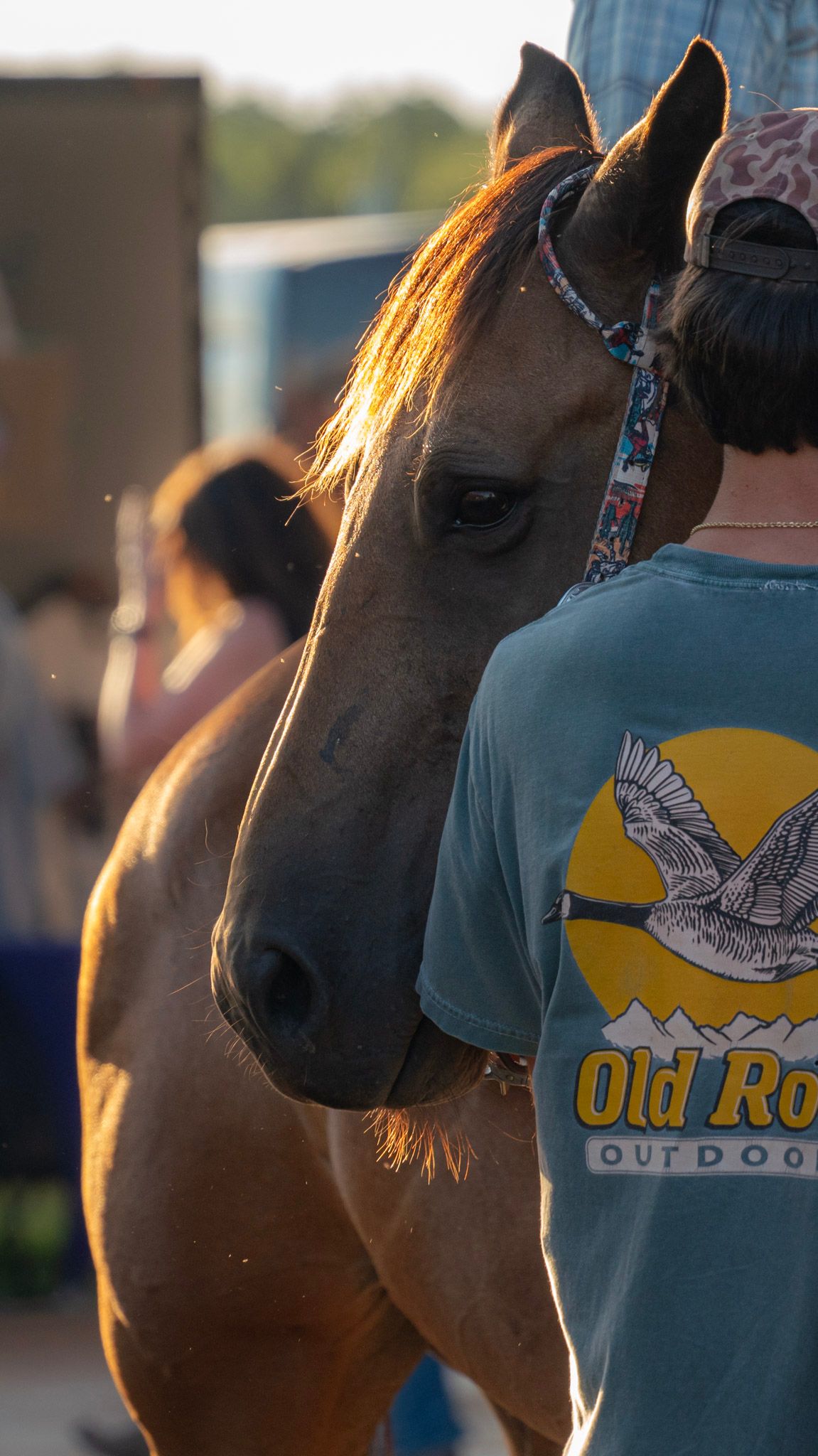 man standing with horse