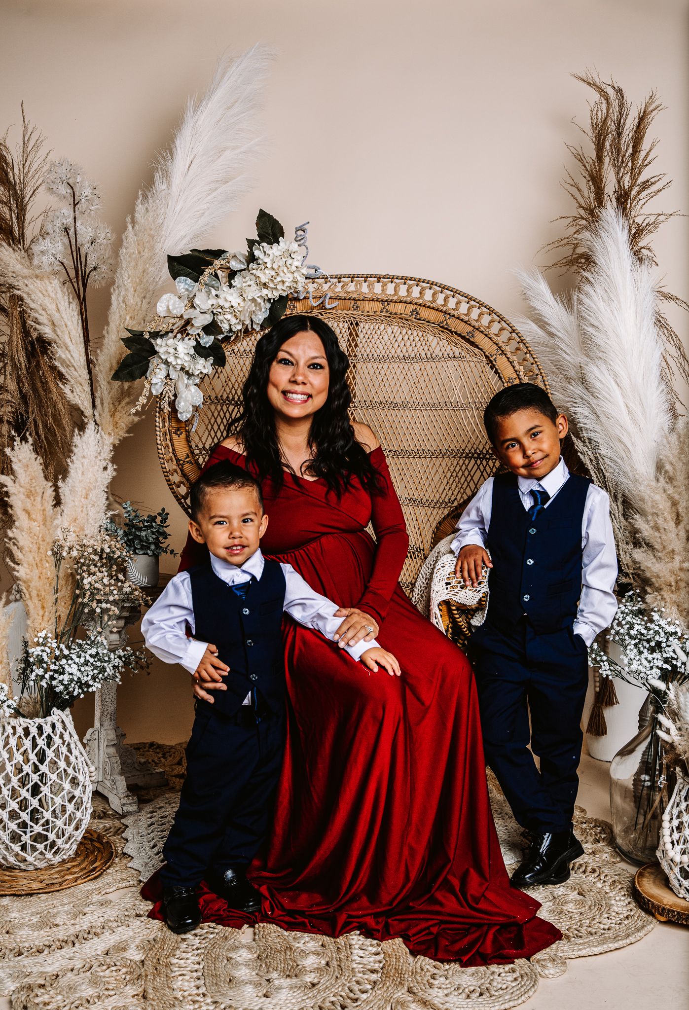 maternity photoshoot of mother and 2 sons in studio photoshoot in greeley colorado