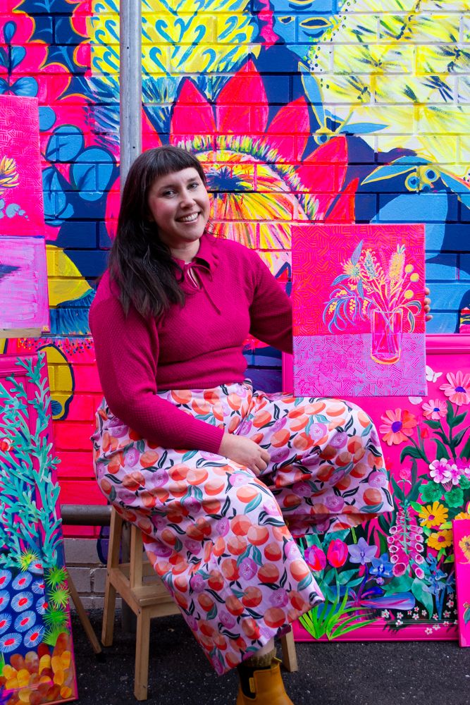 Kate from KateSmithsArt in front of her mural in Bendigo's Penny Weight Walk.