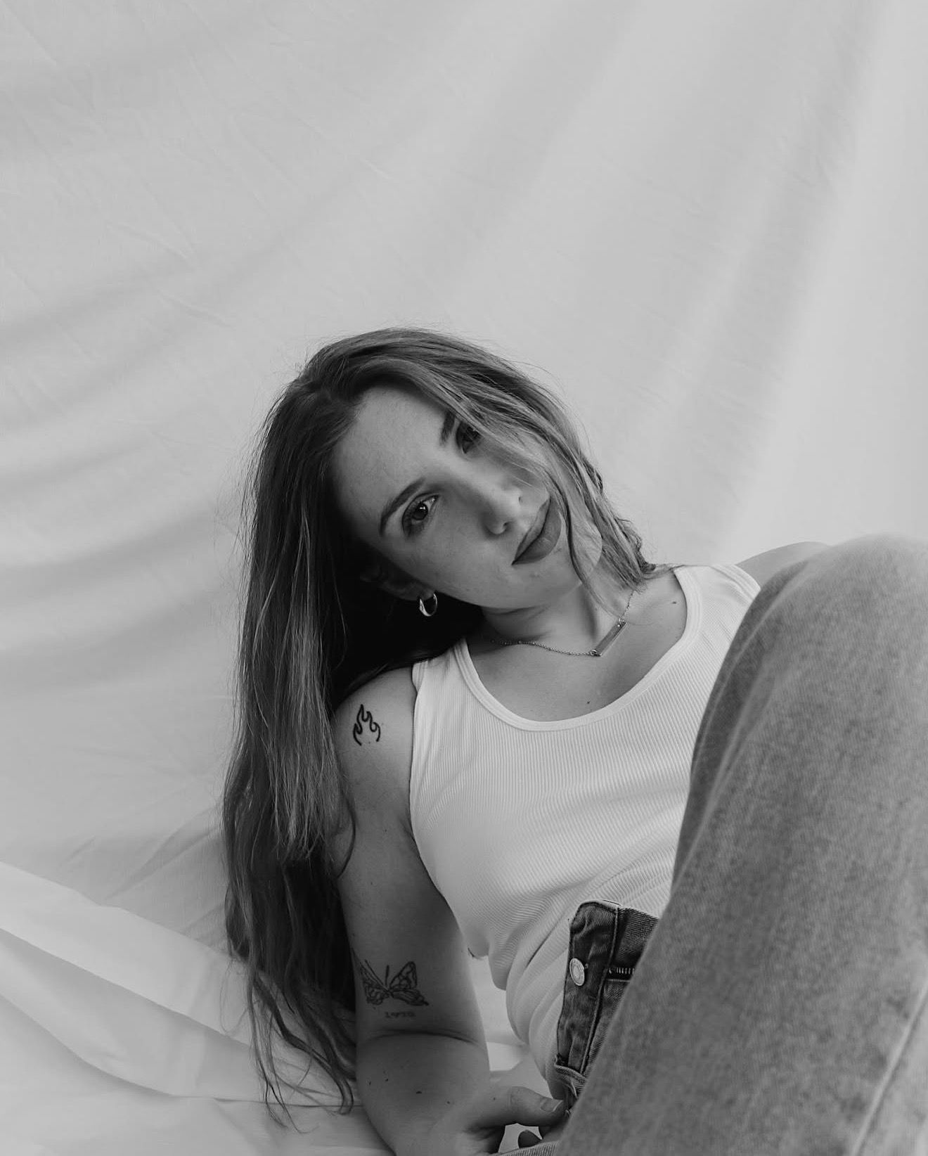 Black and white artistic portrait against white background.