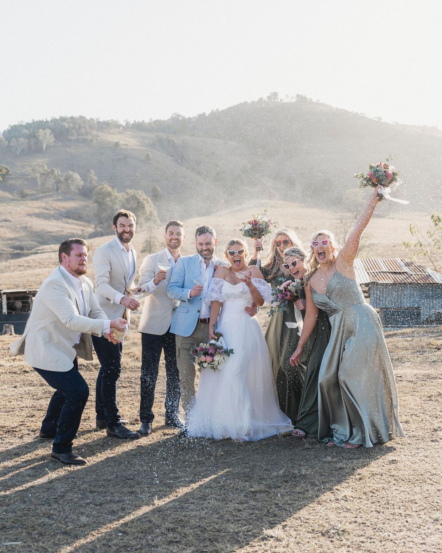 candid champagne pop by Darwin wedding photographer – Weddings by Shiv