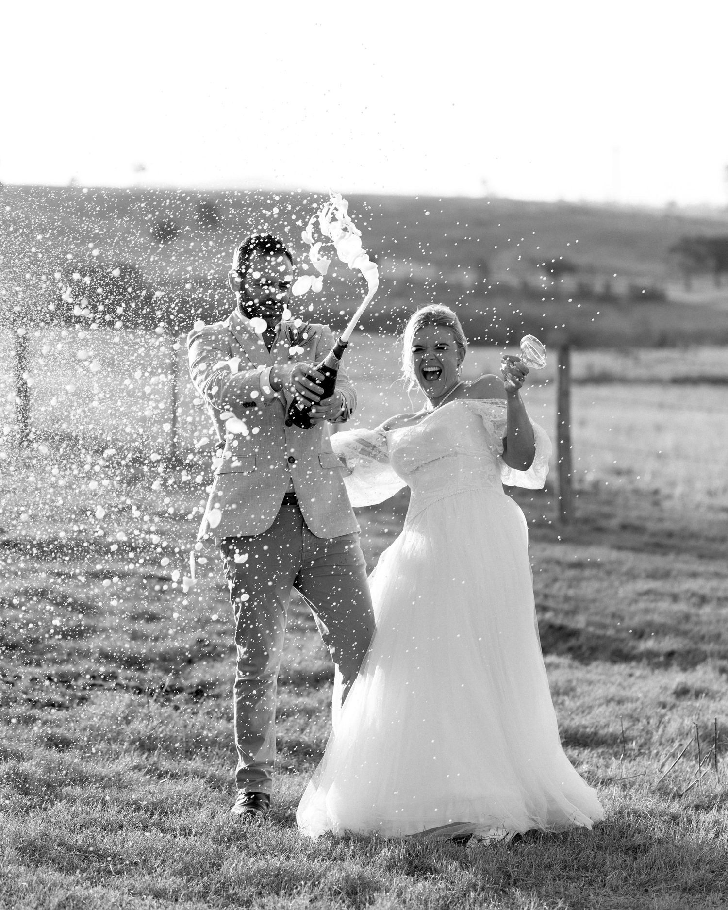 candid champagne pop by Darwin wedding photographer – Weddings by Shiv