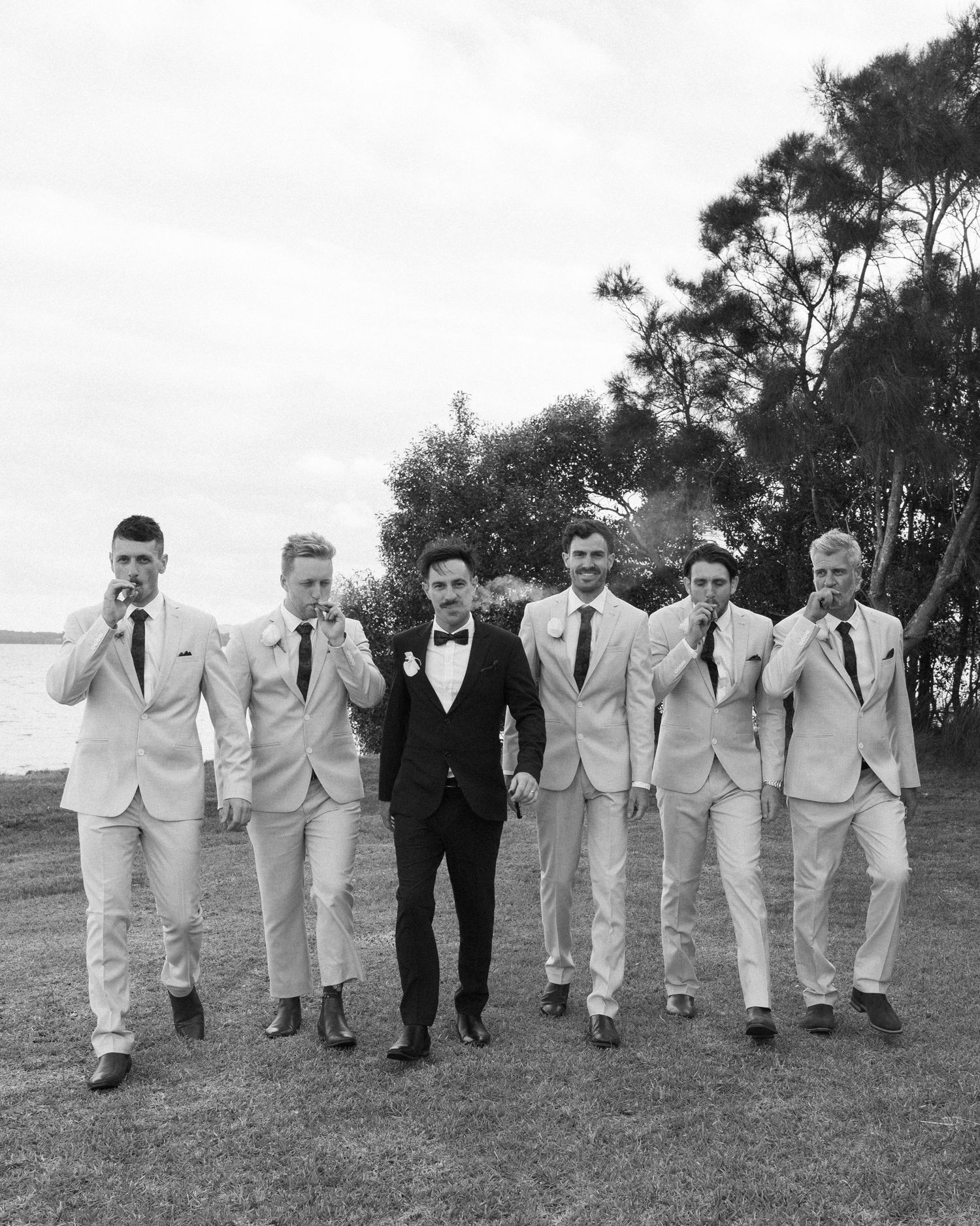 candid groomsmen photo by Darwin wedding photographer – Weddings by Shiv