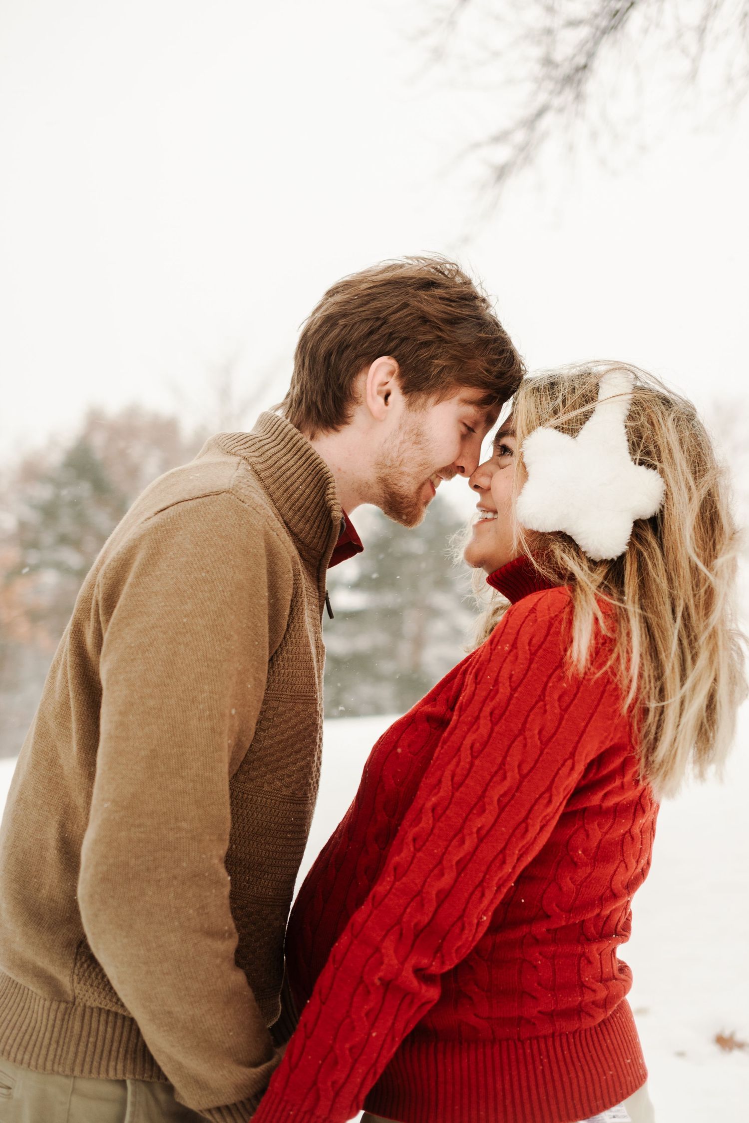 Couple facing each other in Minnesota winter