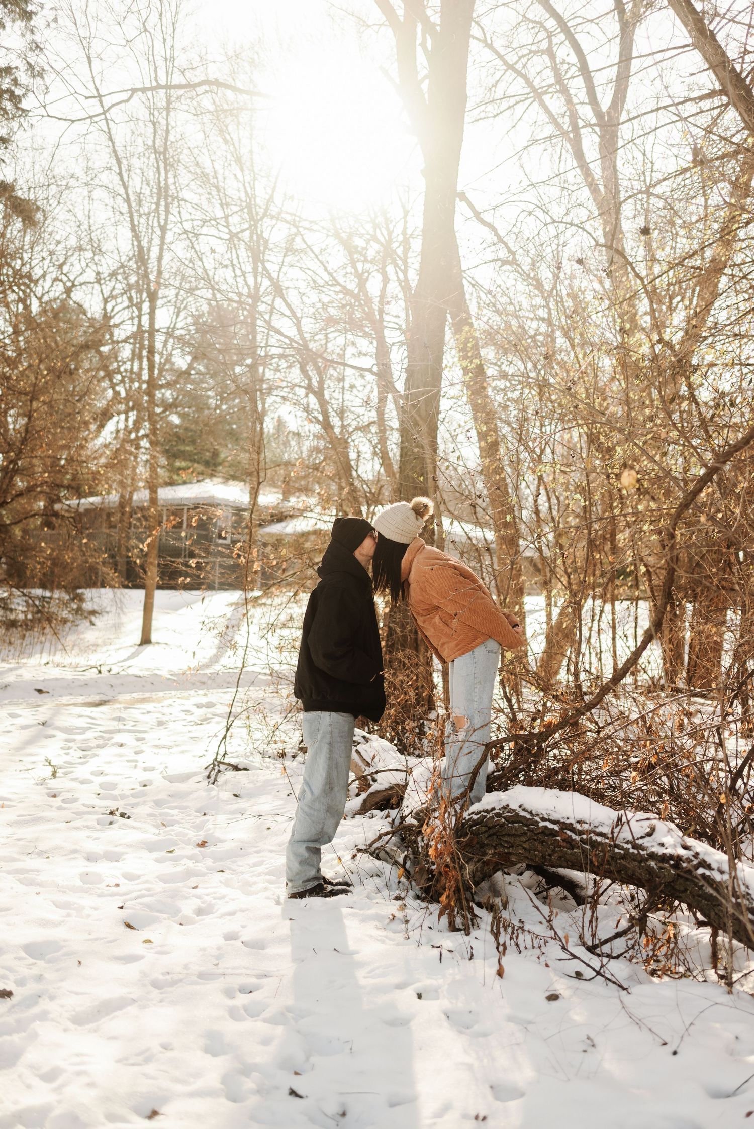 couples photoshoot by pine trees in Minnesota
