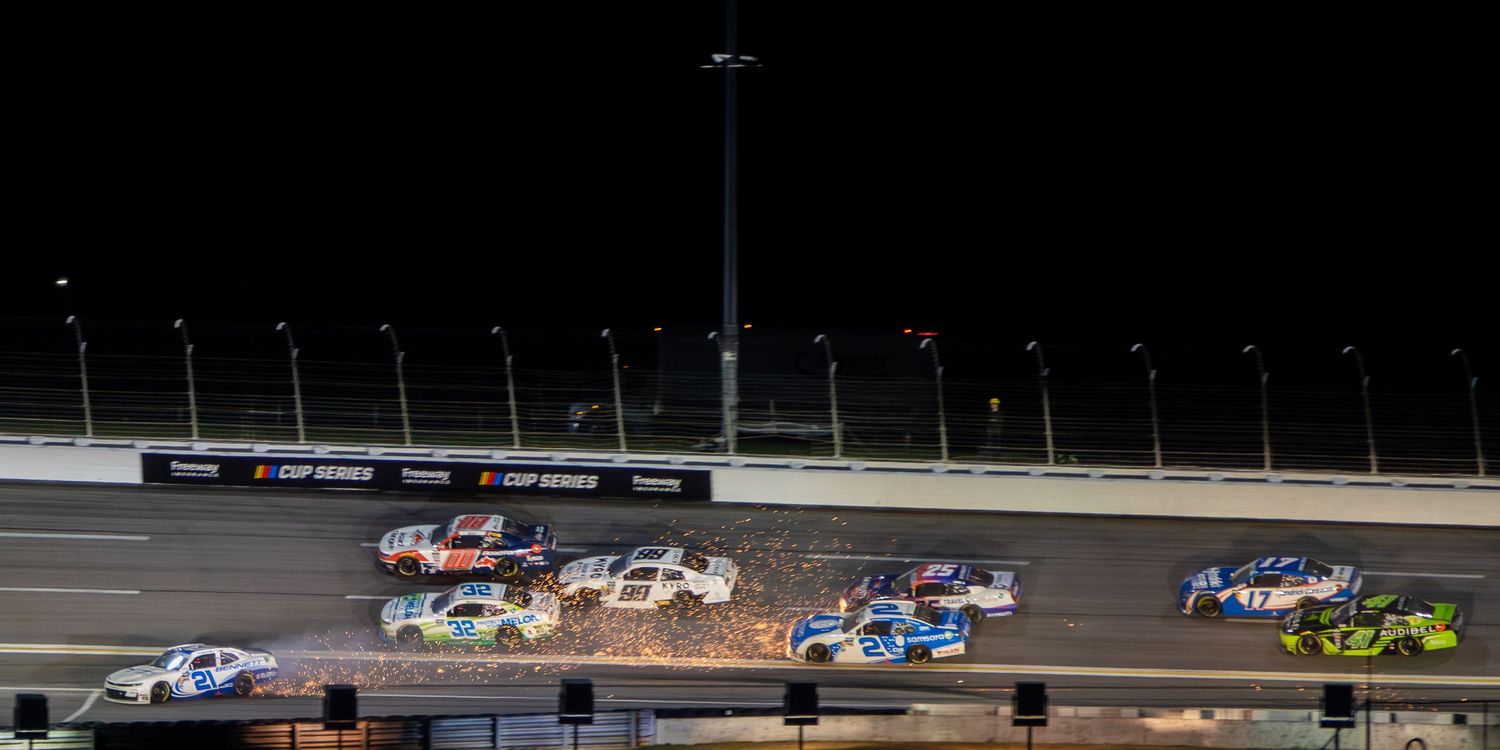 Multiple NASCAR race cars compete under the lights during the Bennet Transportation & Logistics 250 on February 21st 2026