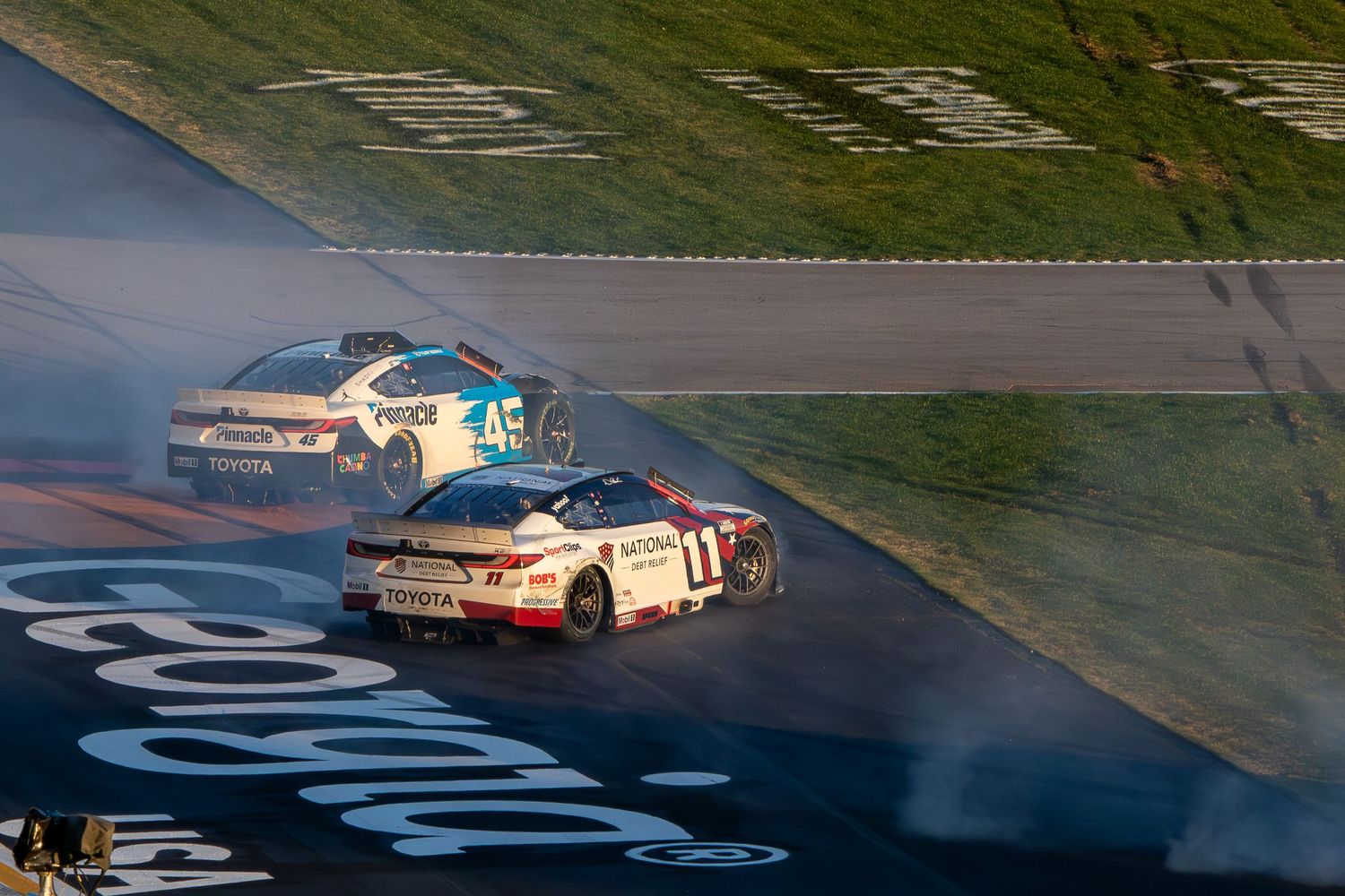 Tyler Reddick and Denny Hamlin Spin during the AutoTrader 400 on February 22nd 2026 at EchoPark Speedway