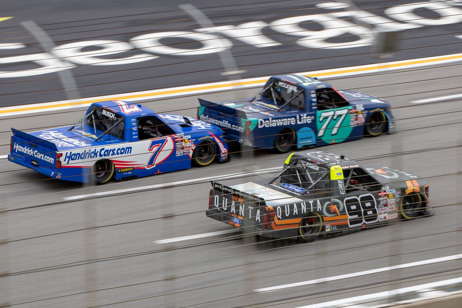 Racing trucks draft closely together during the Fr8 Racing 208 at EchoPark Speedway on February 21st 2026.