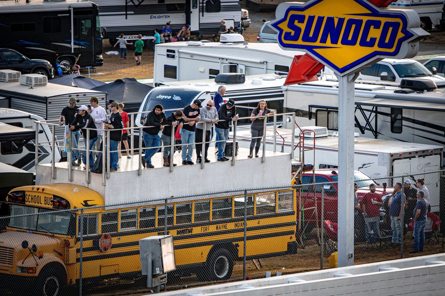 Race track facilities including pit road, school buses, and the Sunoco sign at Echo Park Speedway