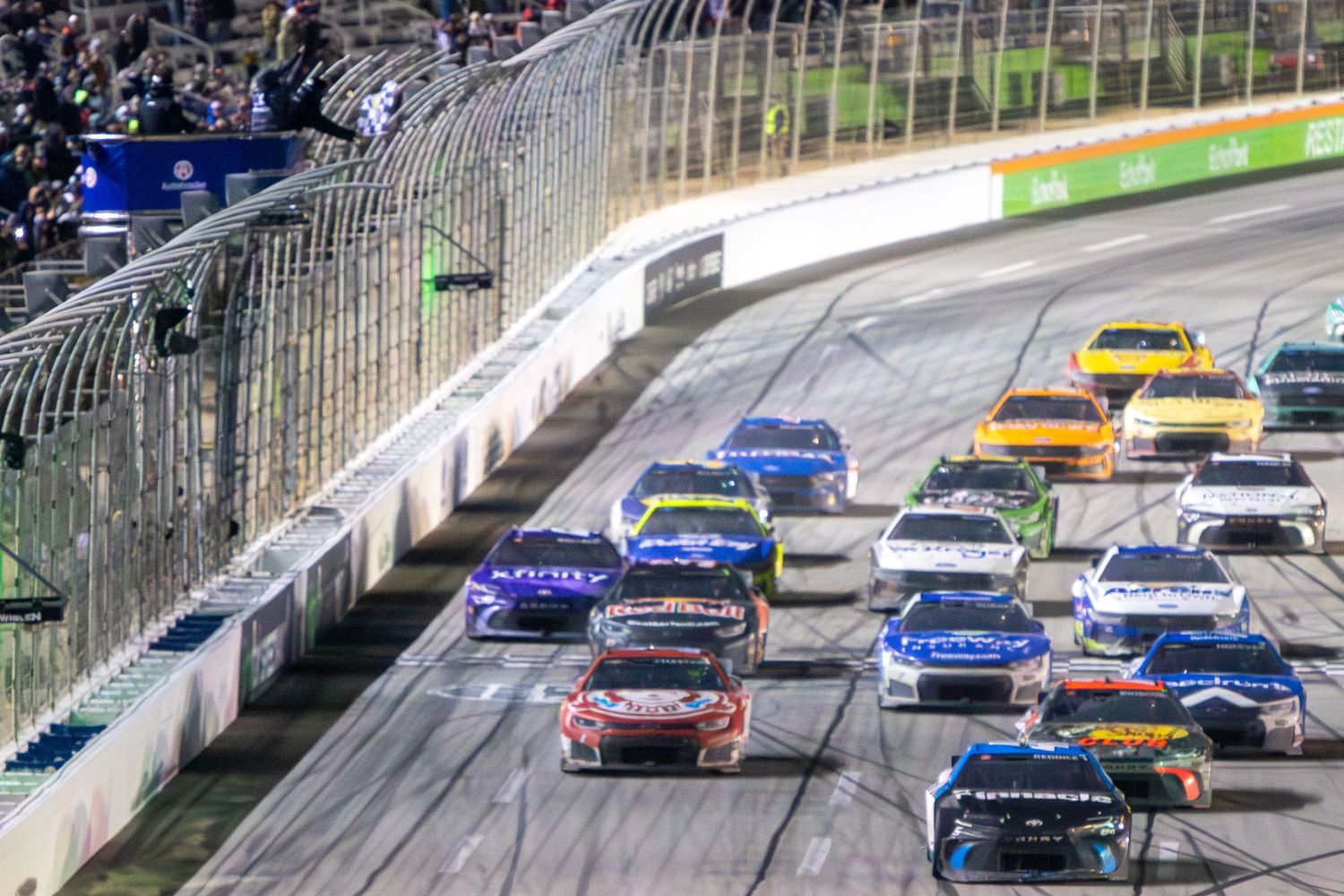Stock cars battle for position during an intense night race at Echo Park Speedway.