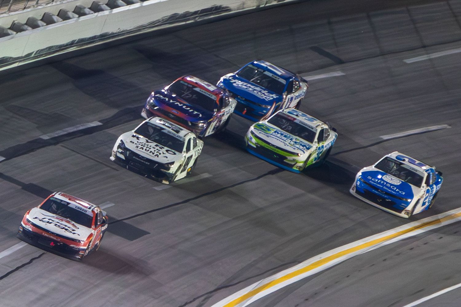 Sheldon Creeds leads a pack to the checkered flag during the Bennet Transportation & Logistics 250 on February 21st 2026