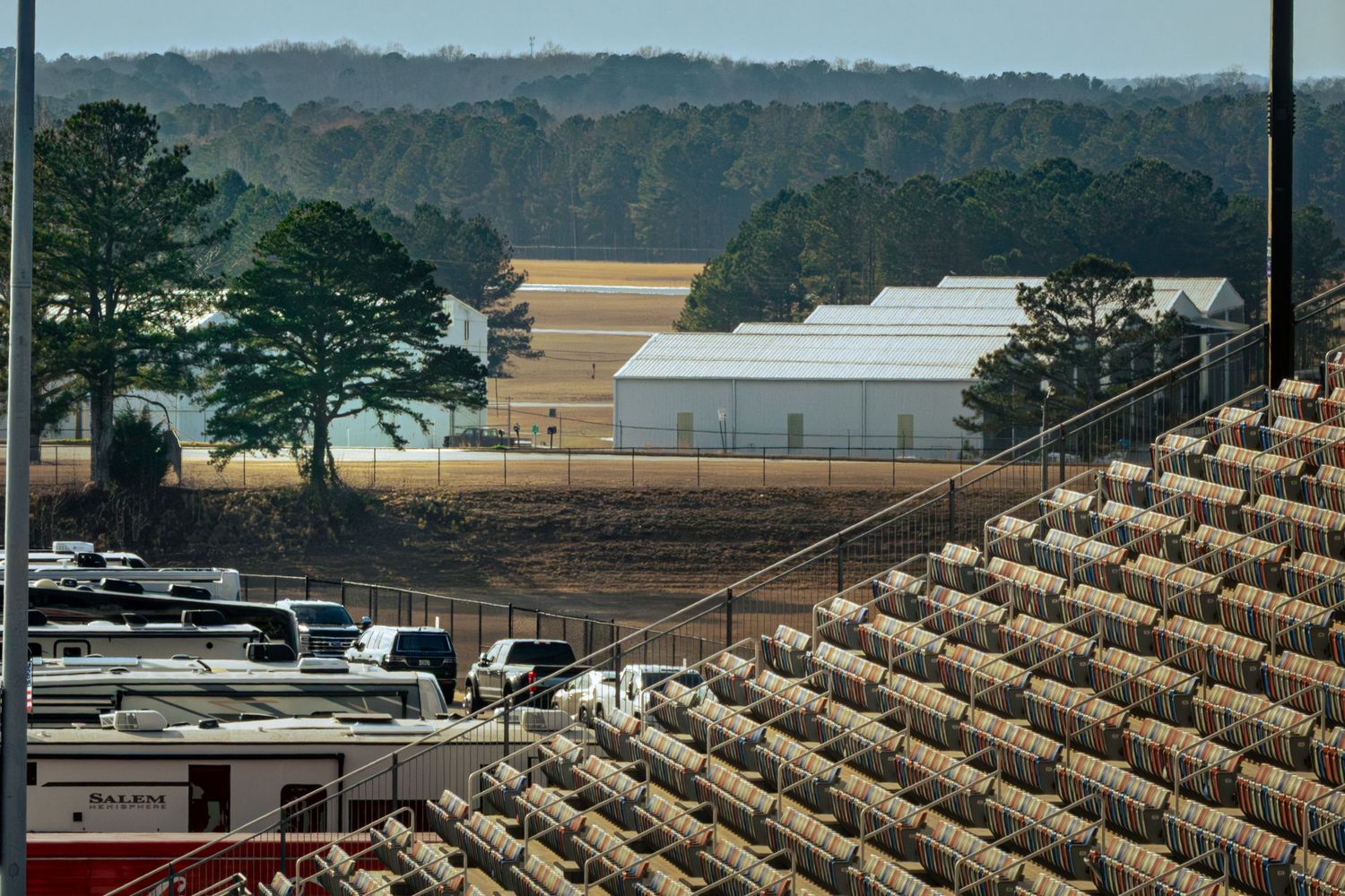 Panoramic view of empty grandstands at a professional racing venue.