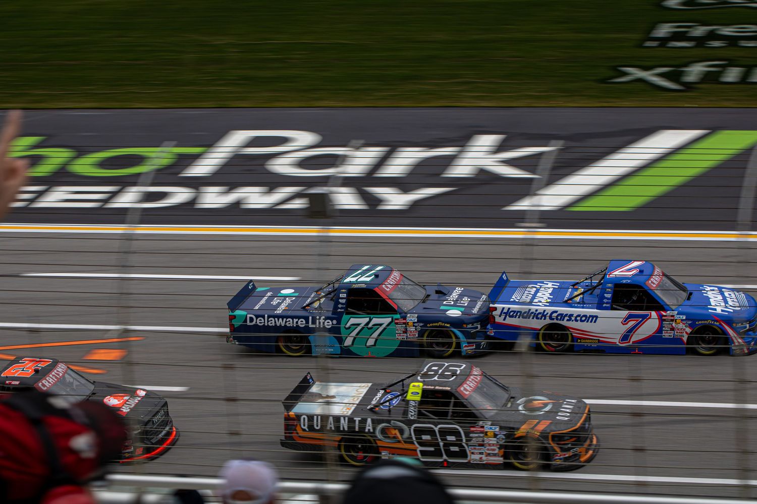 Racing trucks battle for position during the Fr8 Racing 208 at EchoPark Speedway on February 21st 2026.