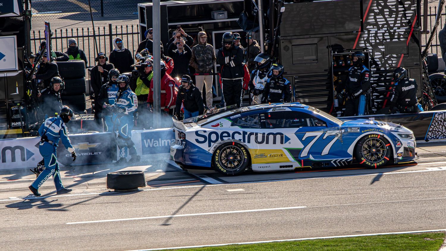 Racing pit crews rush to service Carson Hocevar's car during the AutoTrader 400 on February 22nd 2026 at EchoPark Speedway