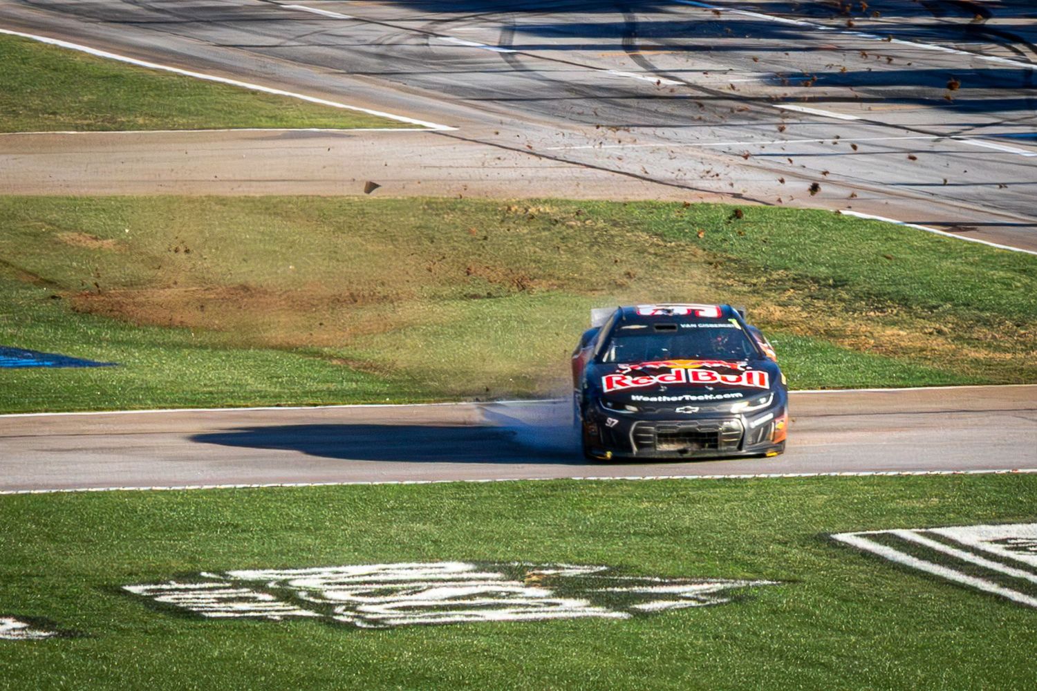 Shane Van Gisbergen drives through the infield grass during the AutoTrader 400 on February 22nd 2026 at EchoPark Speedway