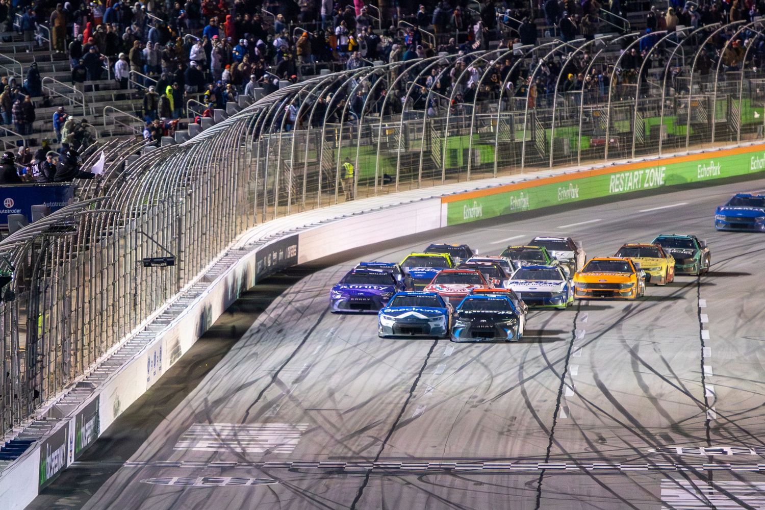 NASCAR vehicles navigate around EchoPark Speedway