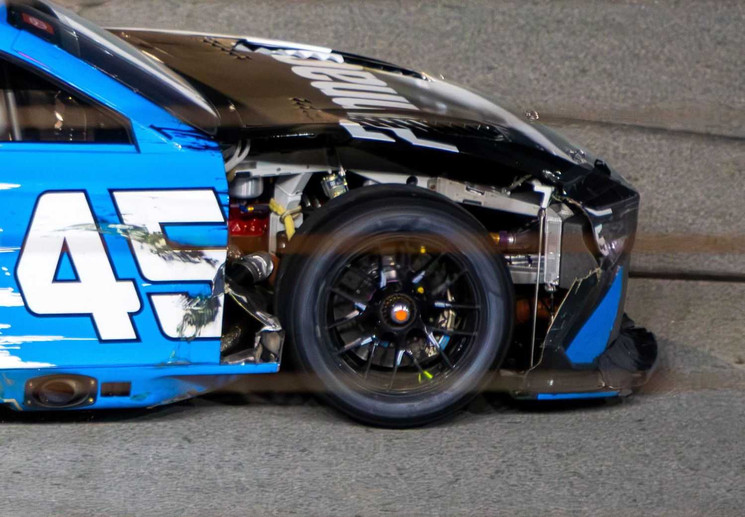 Close-up view of Tyler Reddick's race car wheels and bodywork during the AutoTrader 400 on February 22nd 2026 at EchoPark Speedway