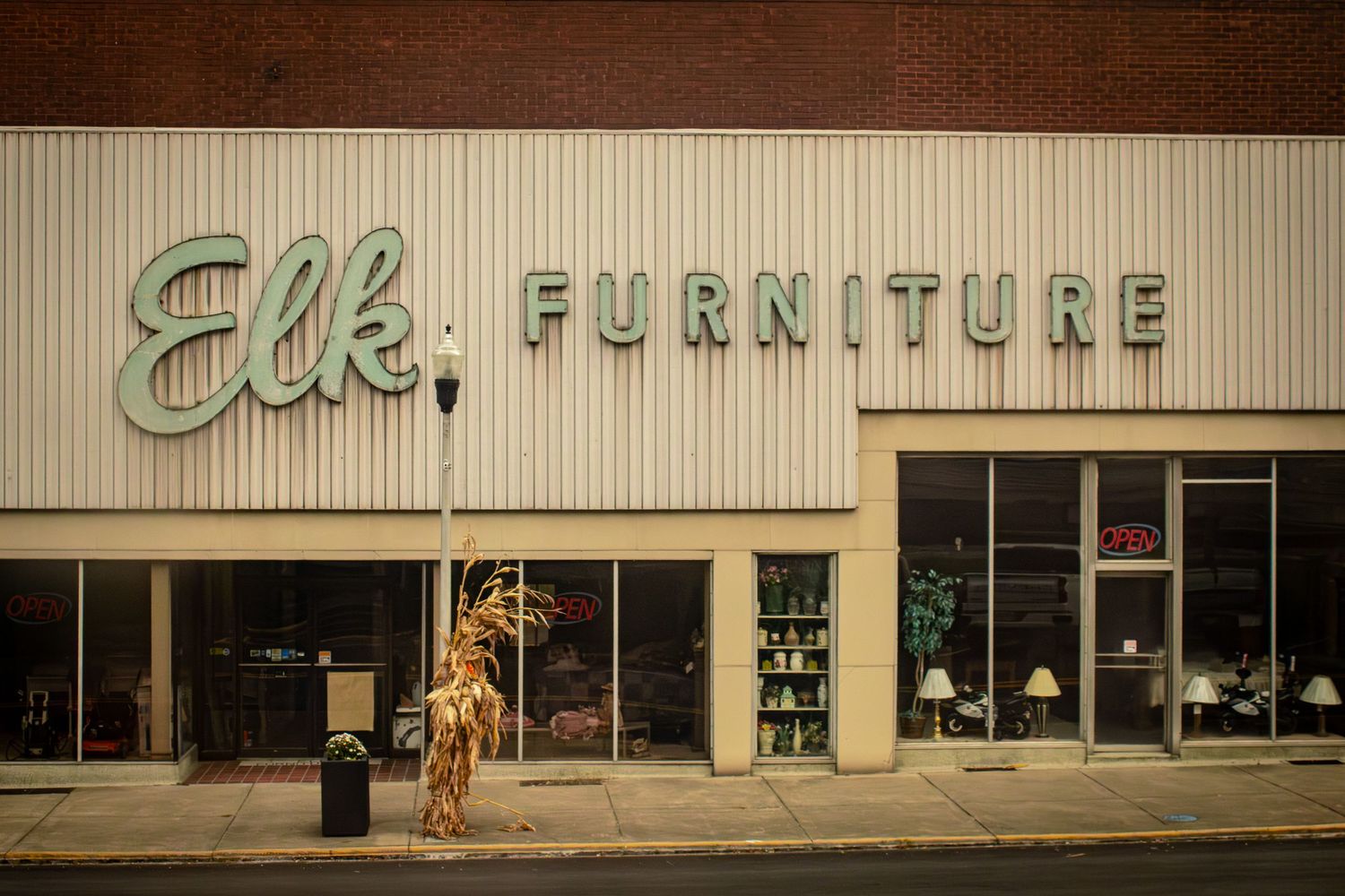 Vintage storefront of Elk Furniture with retro signage and mid-century design elements.