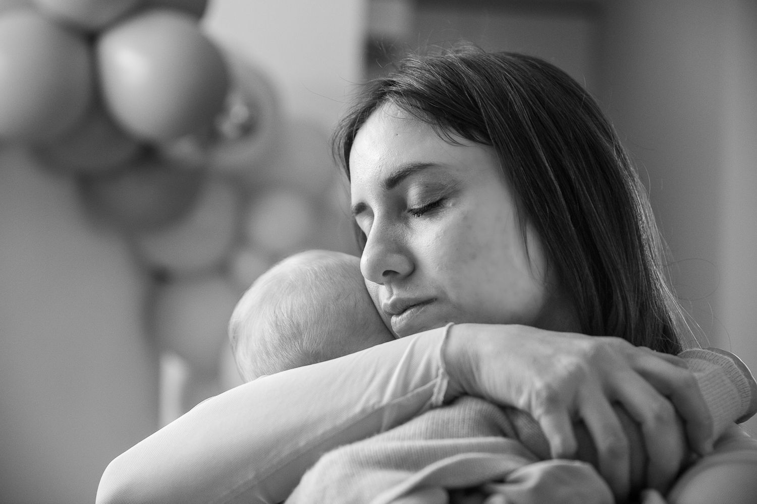 Black and white series of tender family moments.