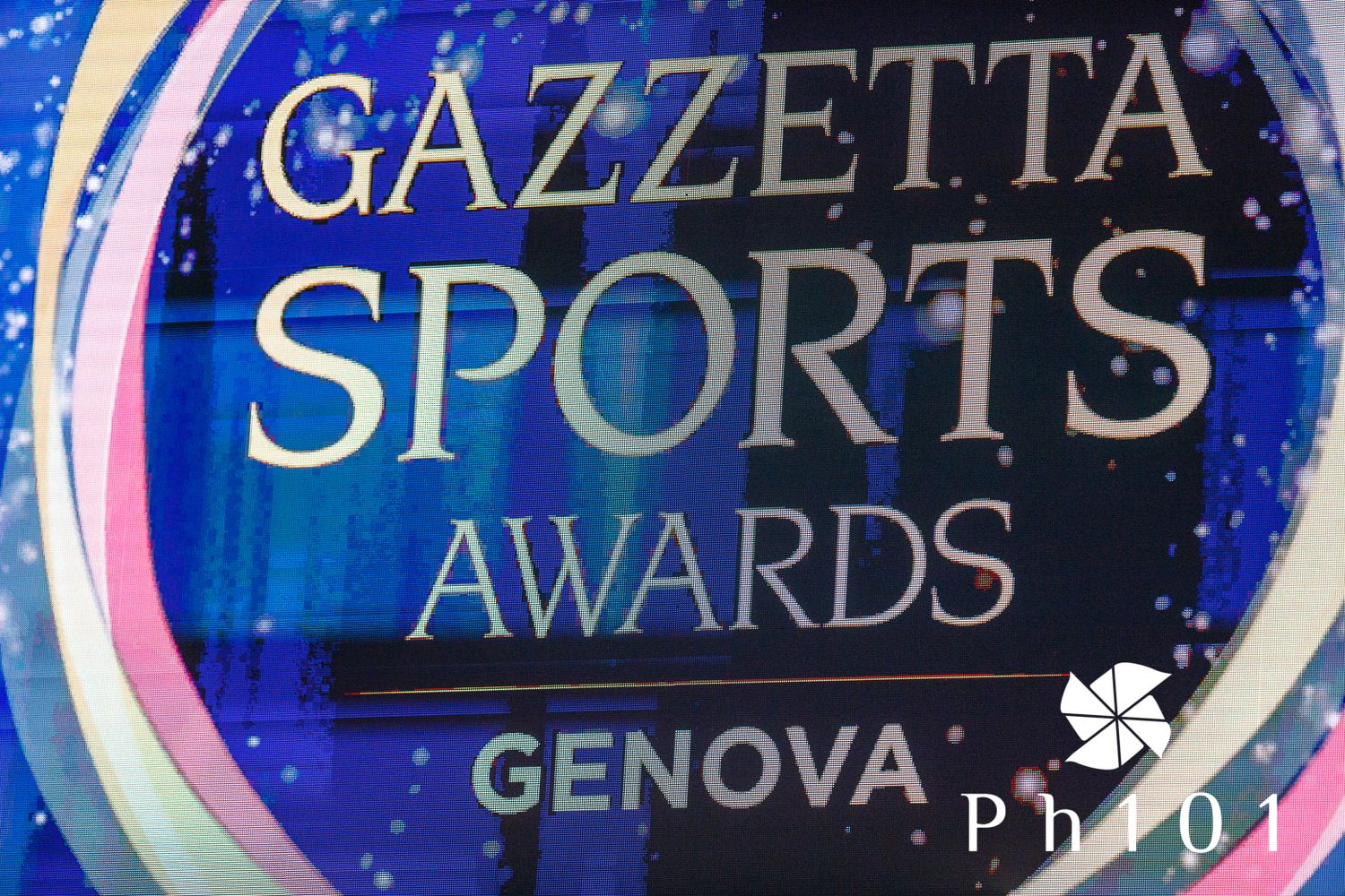 Blue illuminated logo display for Gazzetta Sports Awards in Genova.