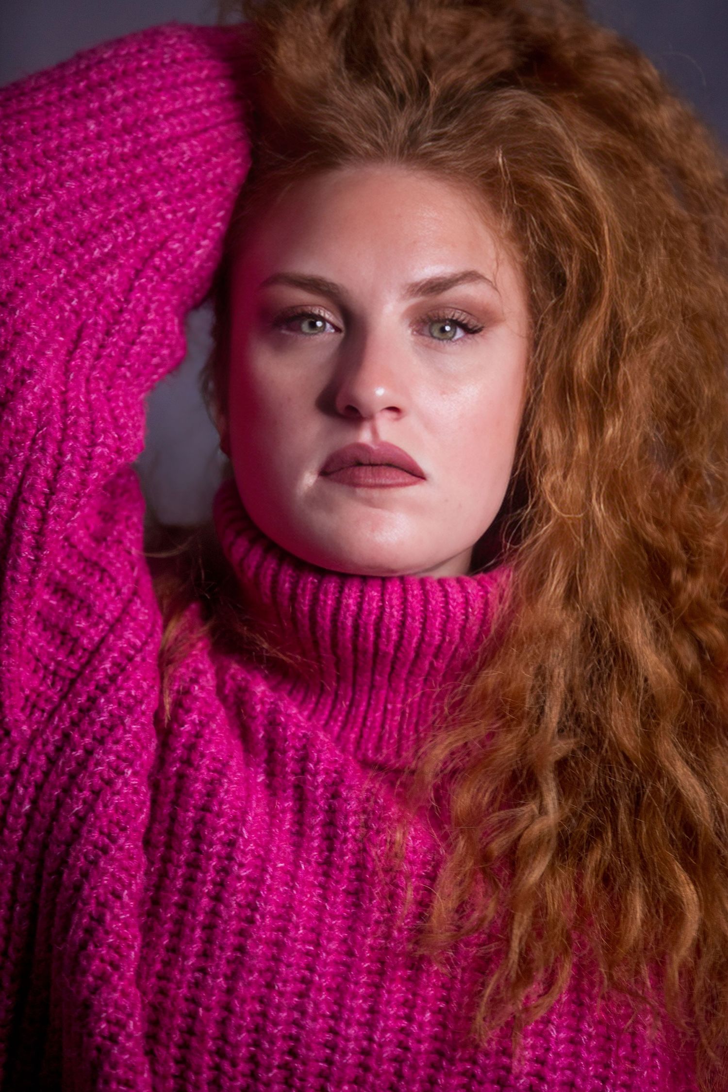 Close-up fashion portraits featuring pink turtleneck sweater and flowing hair.