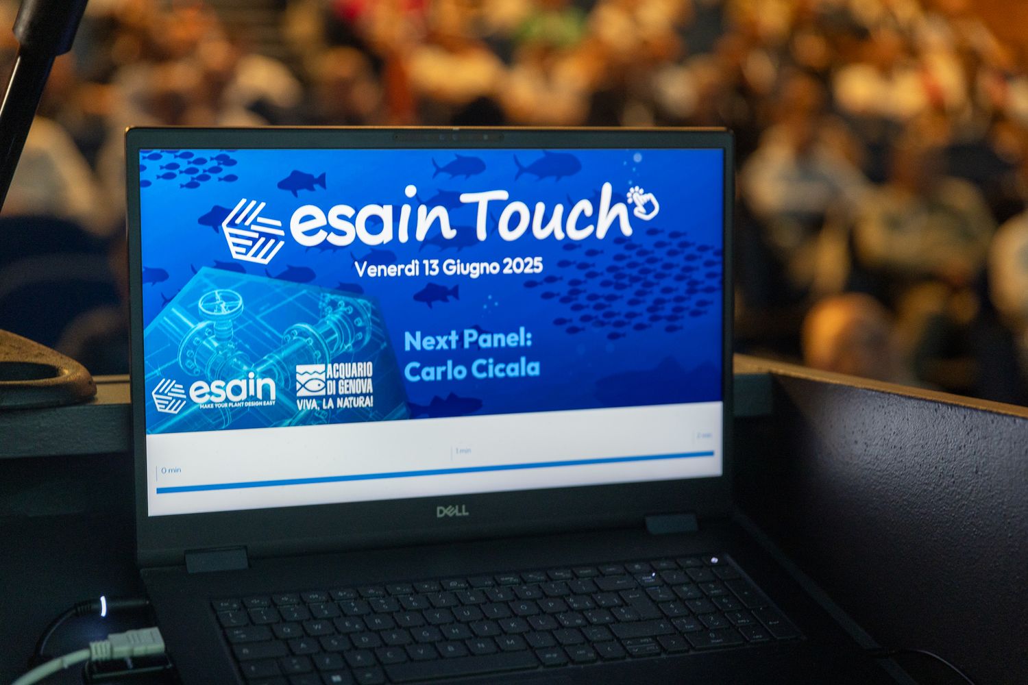 Conference displays showing Esain Touch branding and technology interfaces.