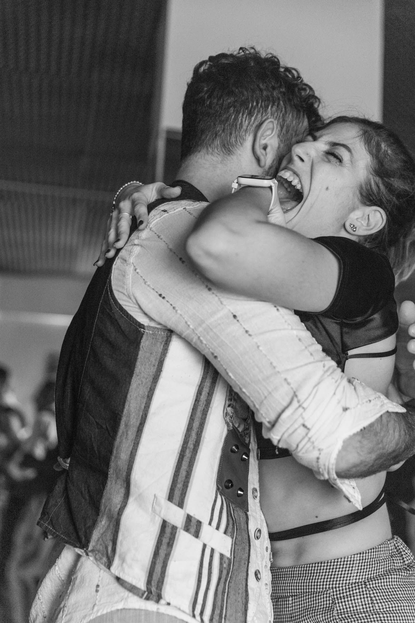 Two dancers share an intimate moment during a passionate dance performance.