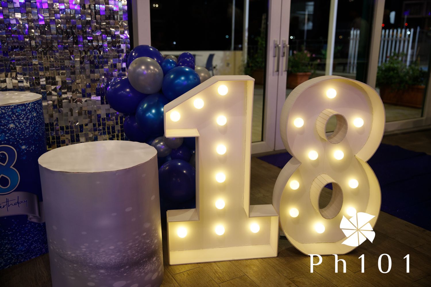 Large illuminated letters spell out text against a sparkly purple background.