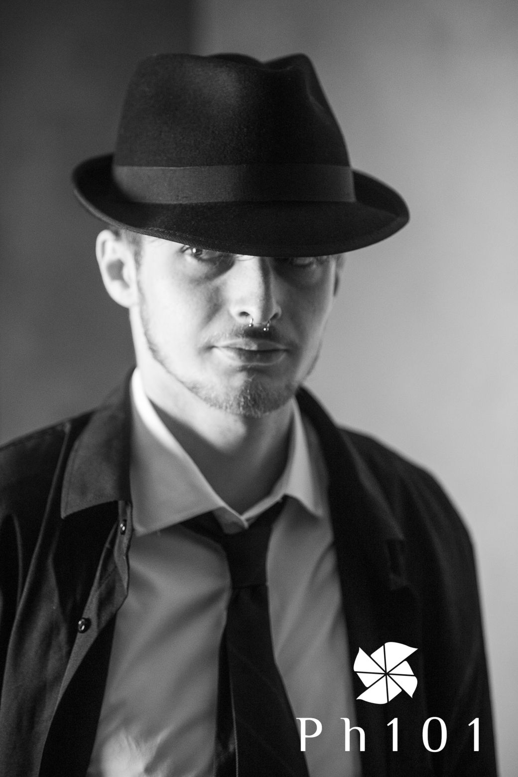 Noir-style portrait sequence of person in black fedora hat and formal attire.