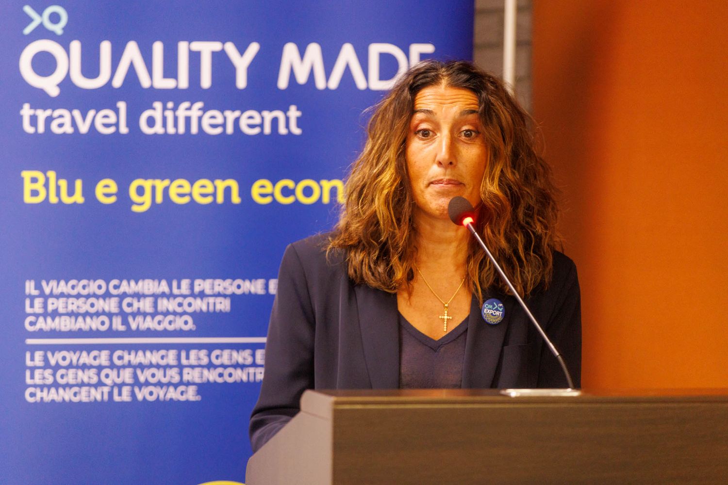 Business magazine covers and branding materials displayed in blue and green color scheme.