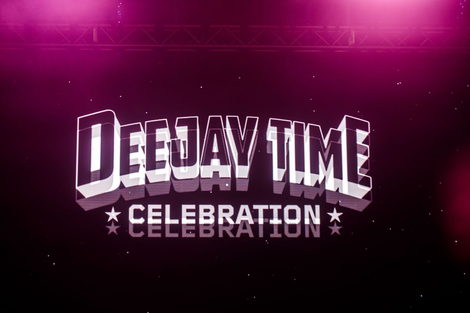 Purple neon sign displaying 'DEEJAY TIME' in bright illuminated letters.