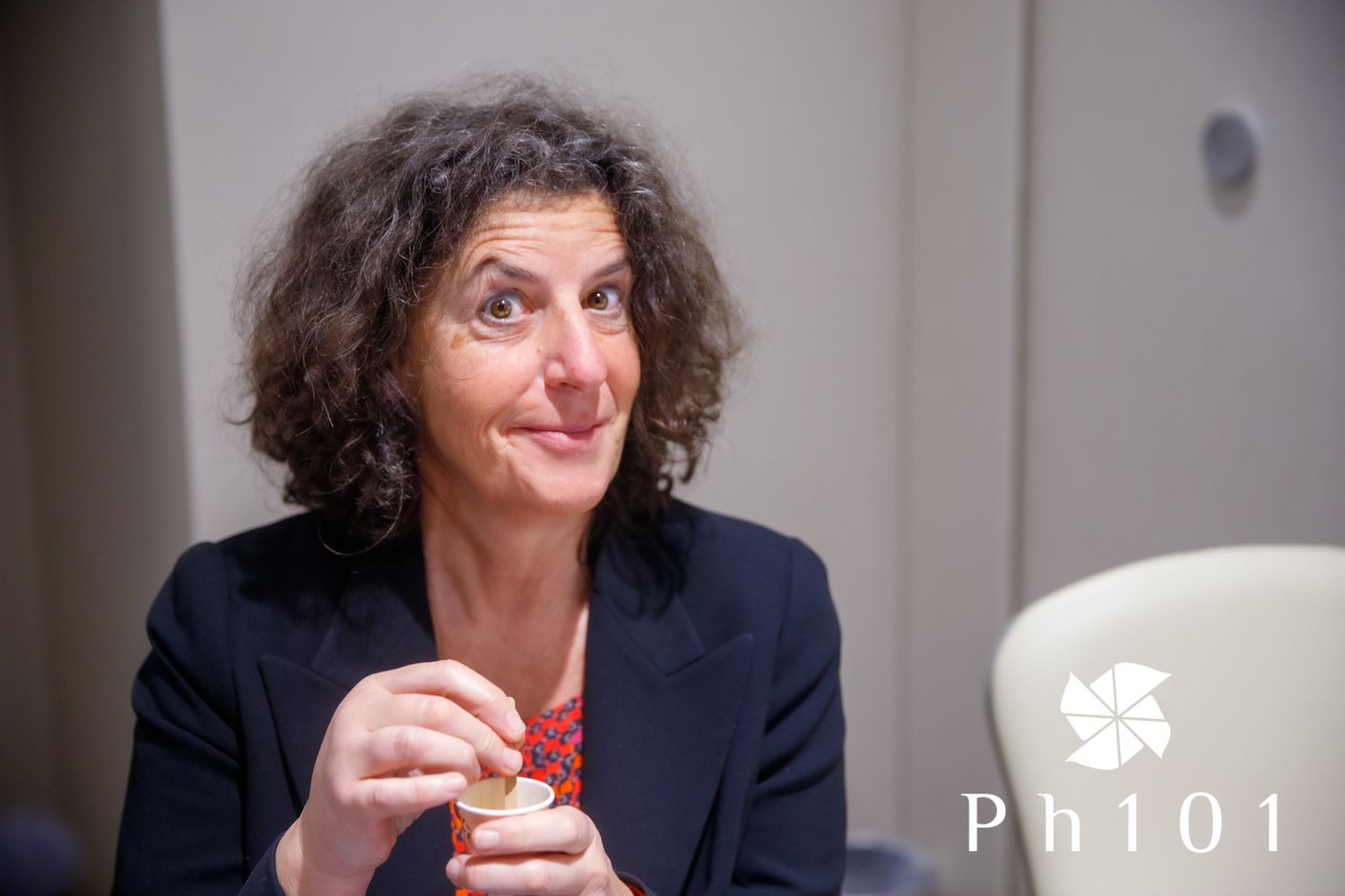Person in dark blazer shown in sequence of expressive poses during indoor photoshoot.