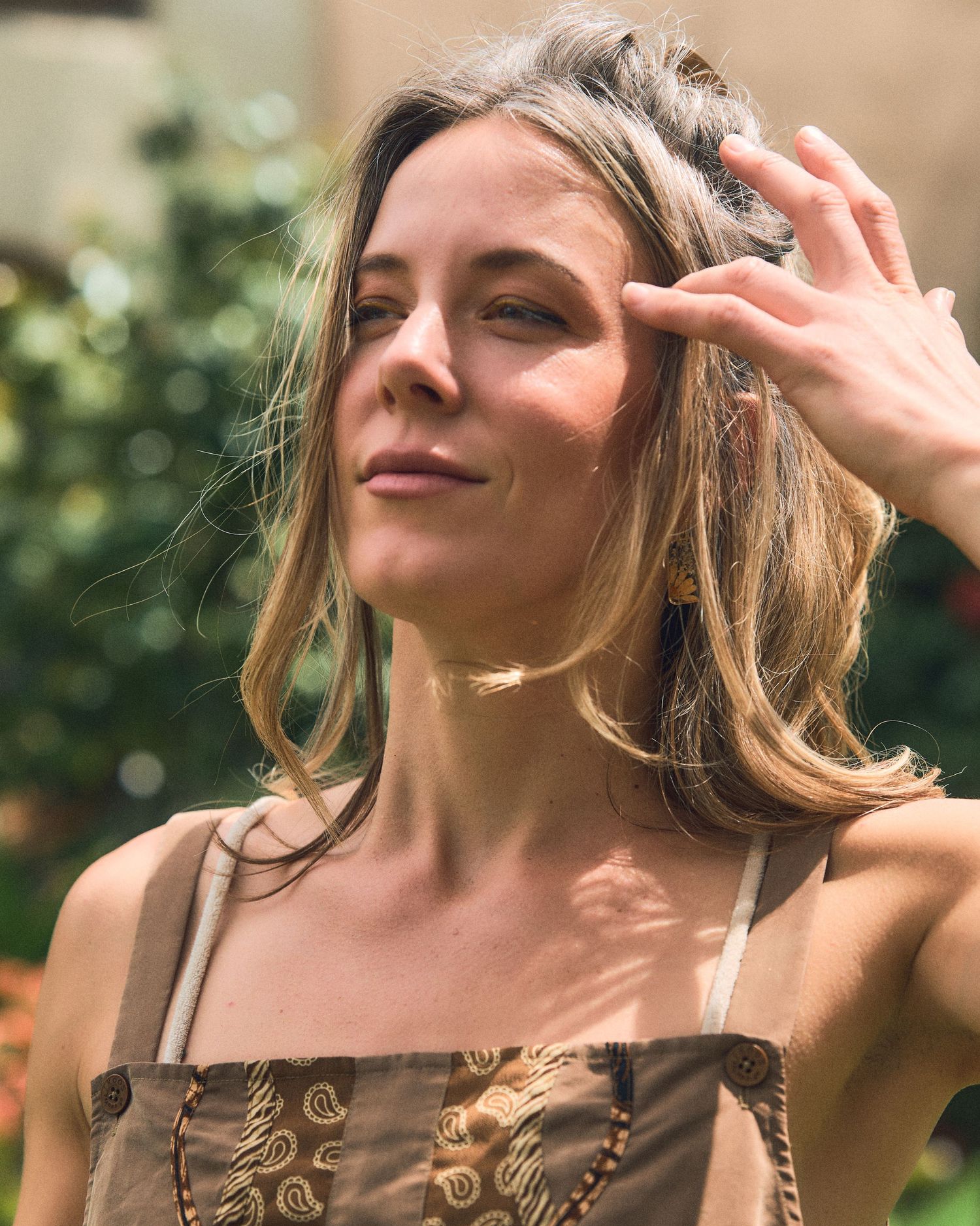 Close-up outdoor portraits showing expressions of joy and movement.