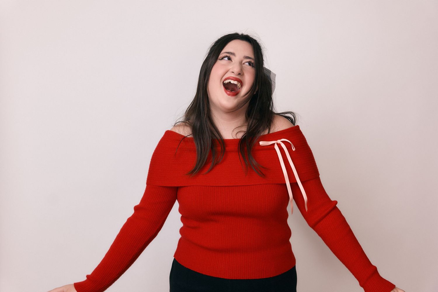 Woman in red sweater showing dynamic poses and expressions against white background.