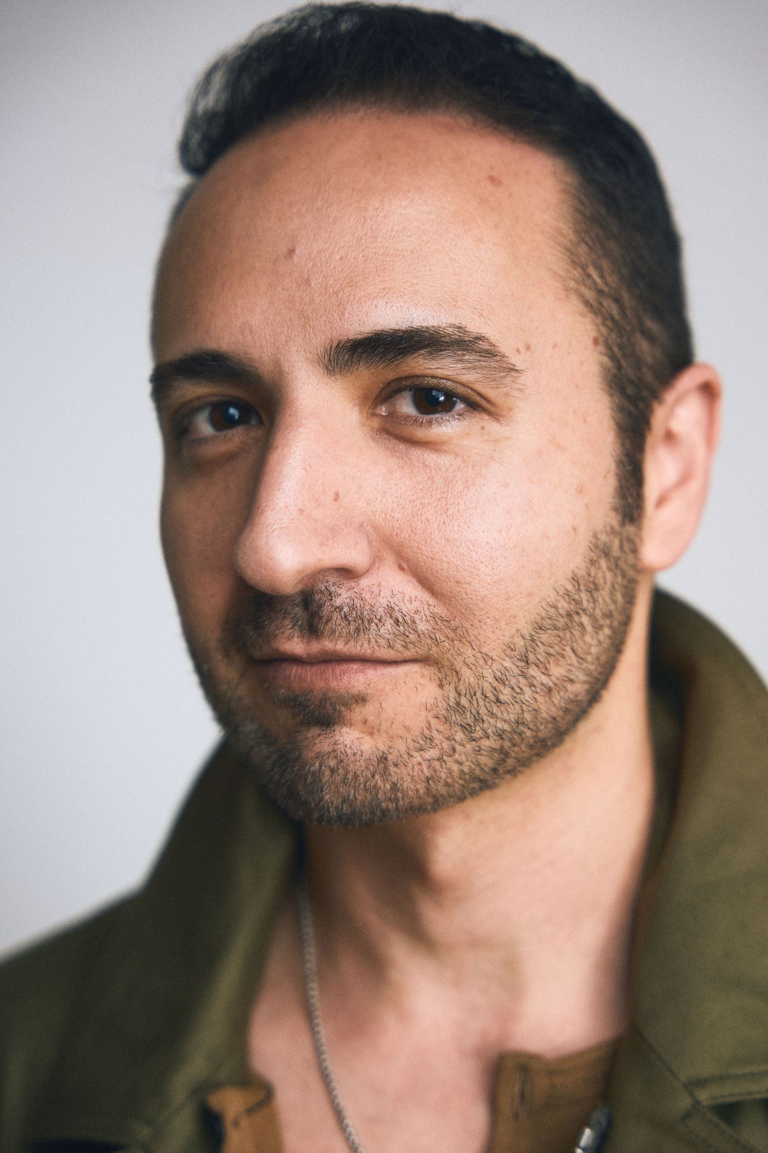 Close-up portrait series showing various expressions and angles against a white background.