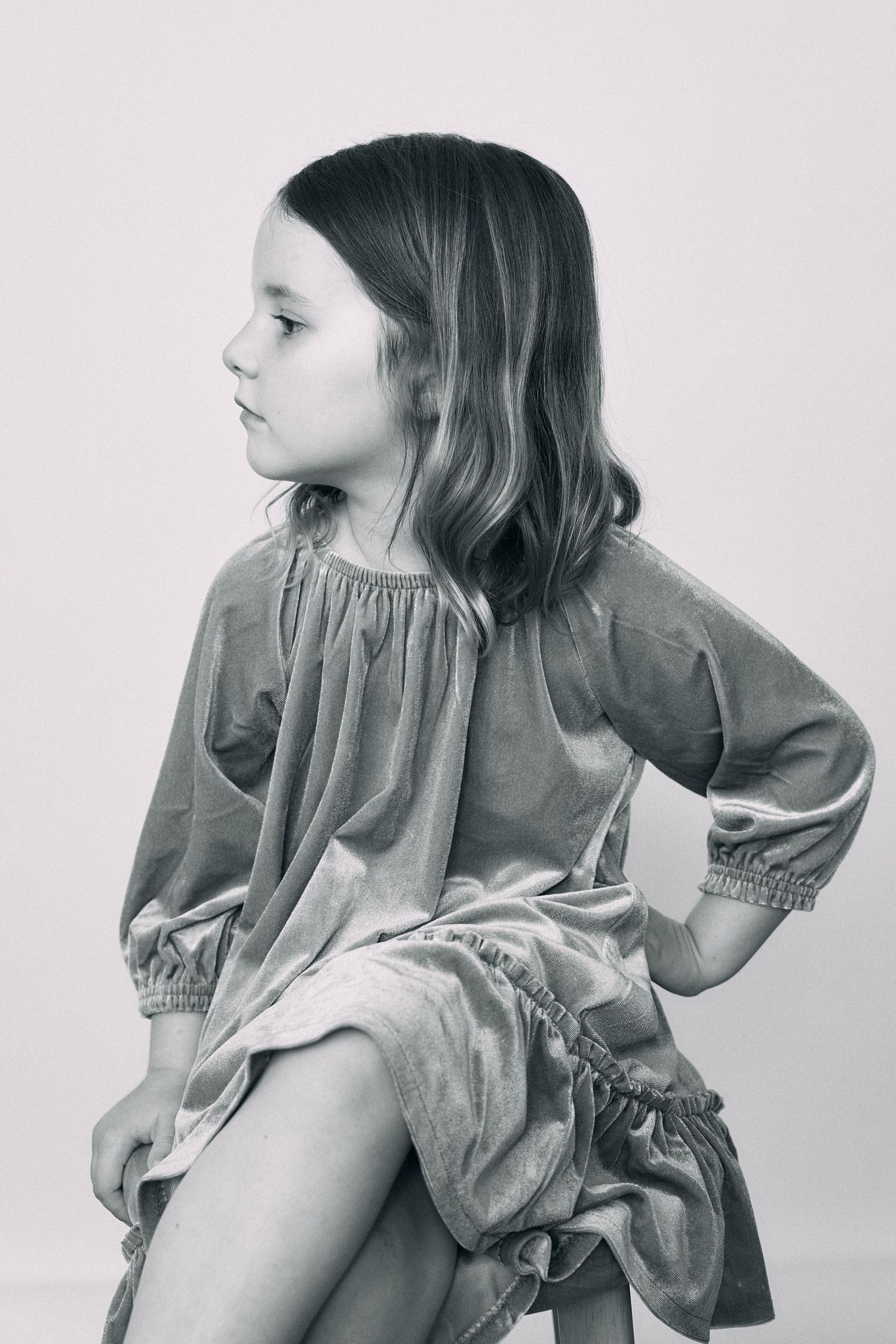 Artistic black and white portraits showing movement in flowing dress.