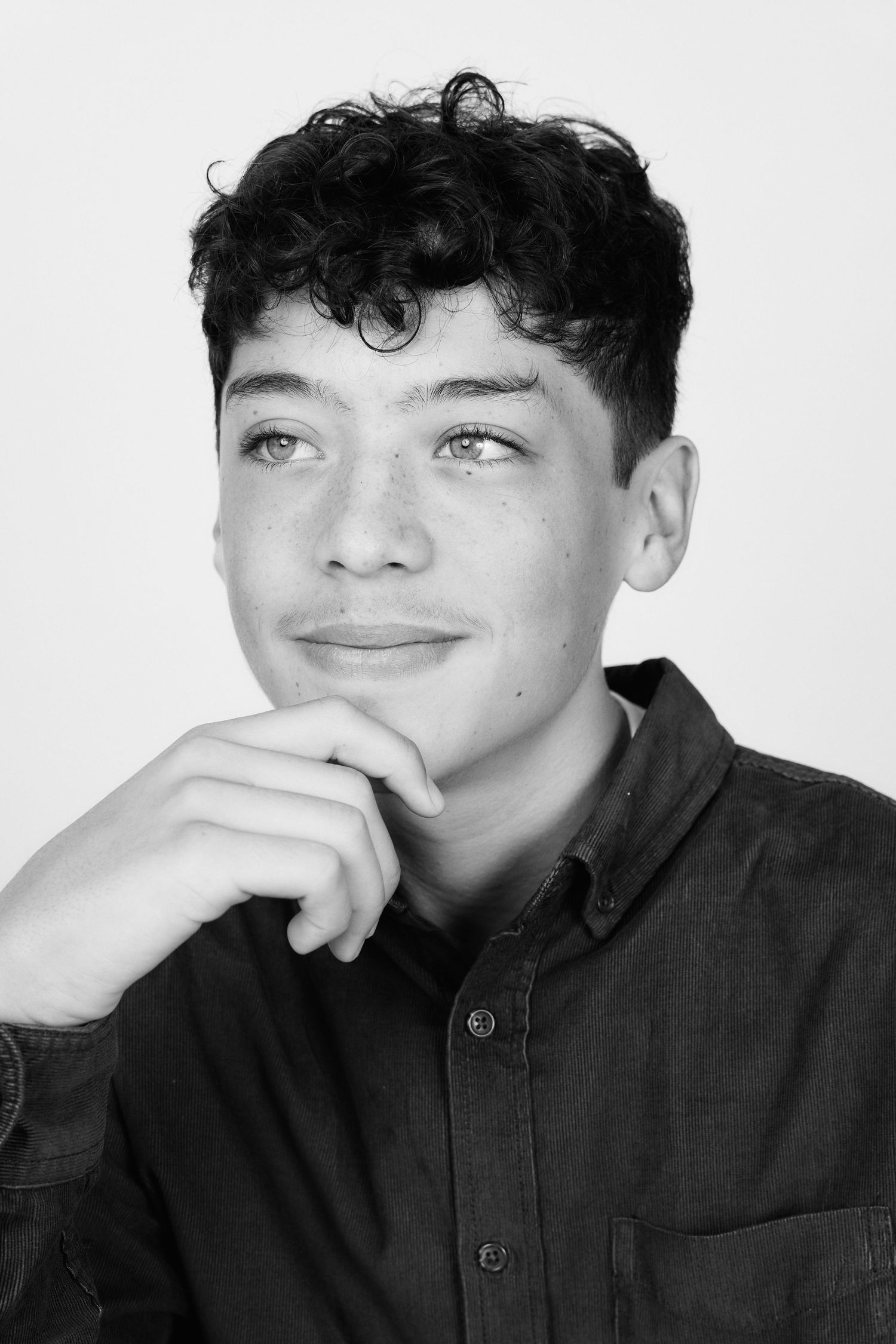Black and white portrait sequence showing playful expressions and hand gestures.
