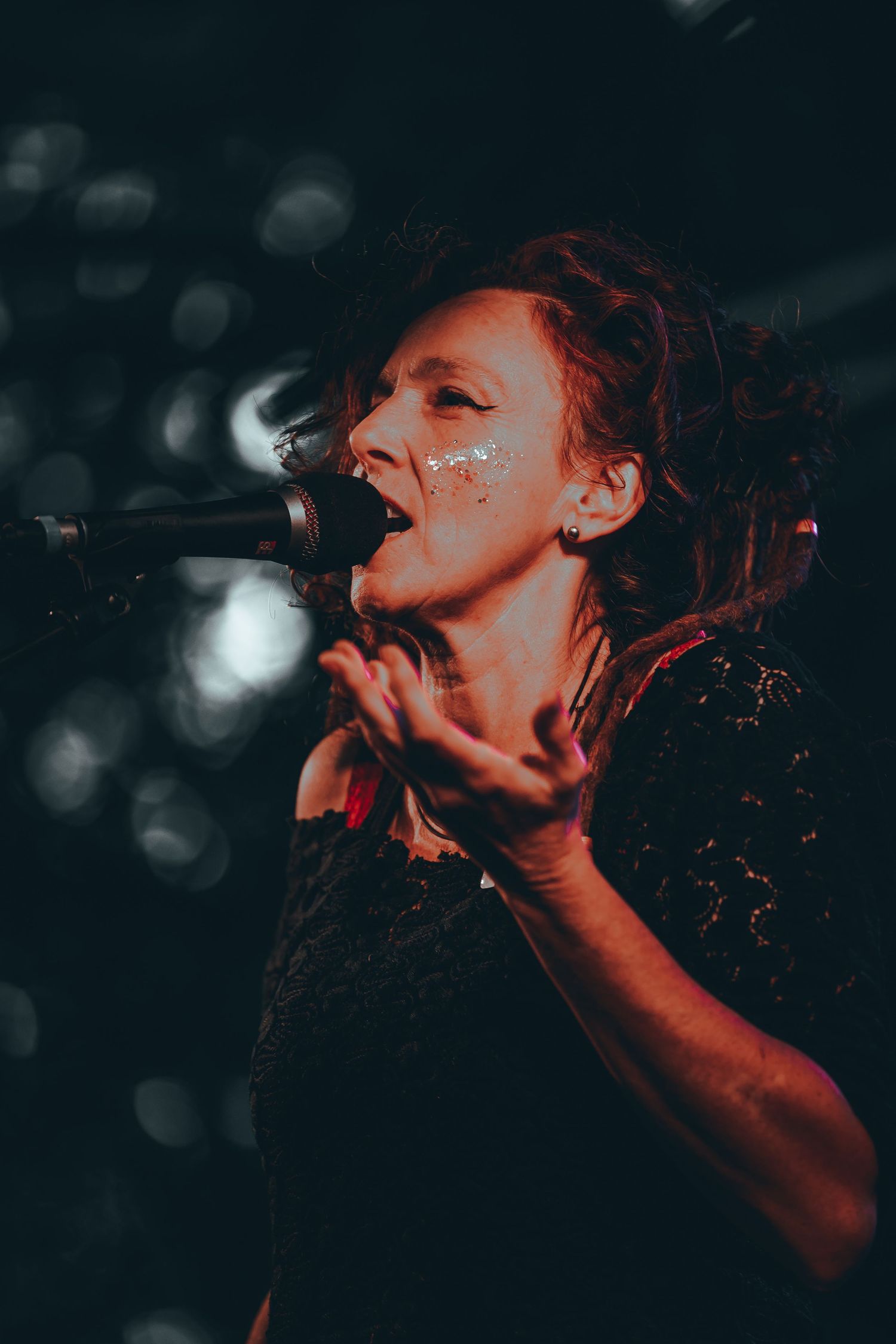 Dynamic performance sequence showing a vocalist singing passionately on stage in dramatic lighting.