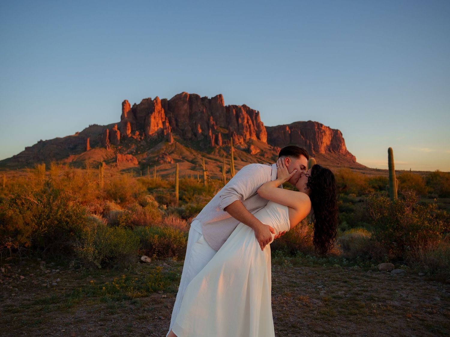 A series of romantic sunset photos at the Superstition Mountains in Arizona with desert landscape and golden light.