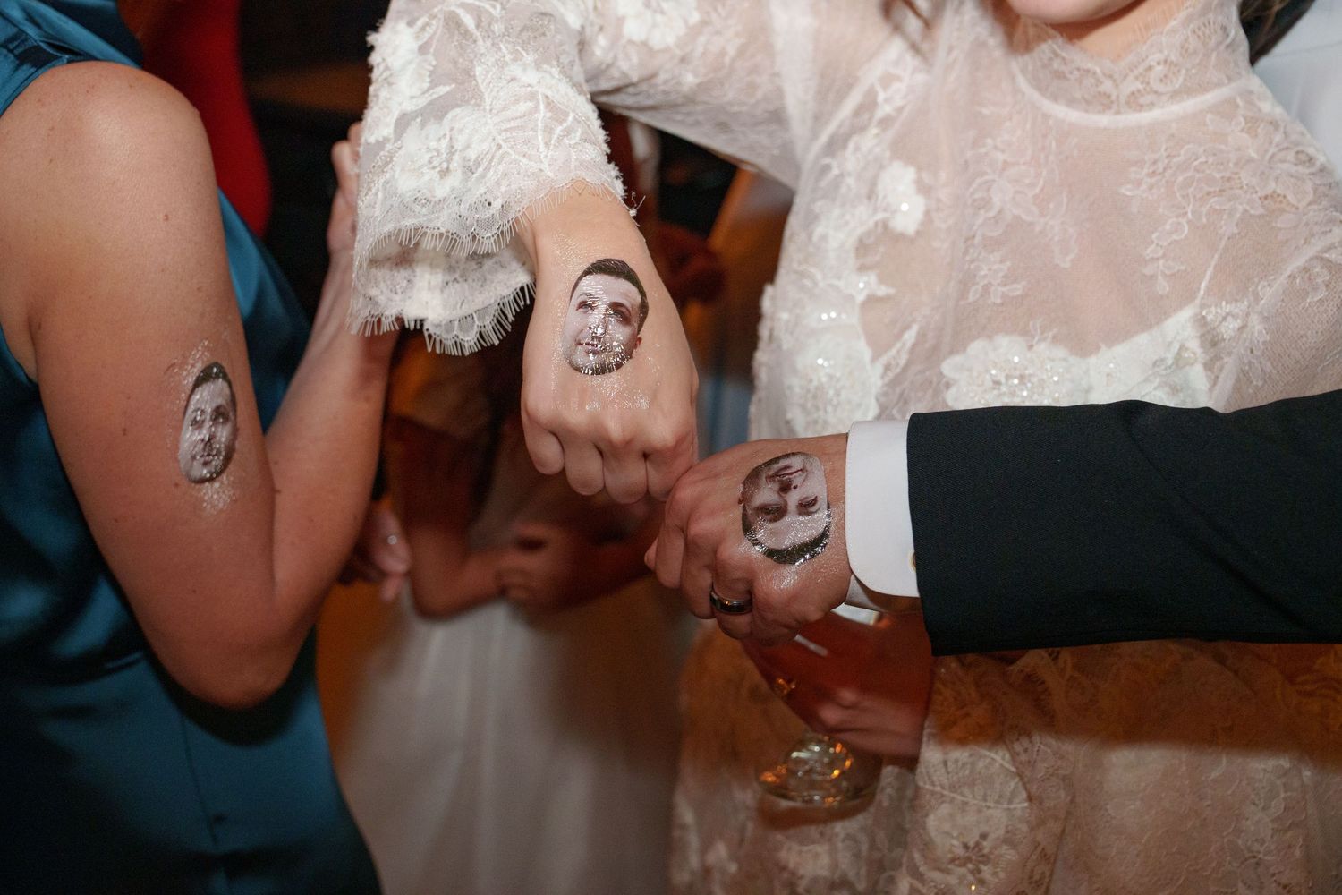 Wedding celebration with guests dancing and enjoying festivities in an indoor venue.