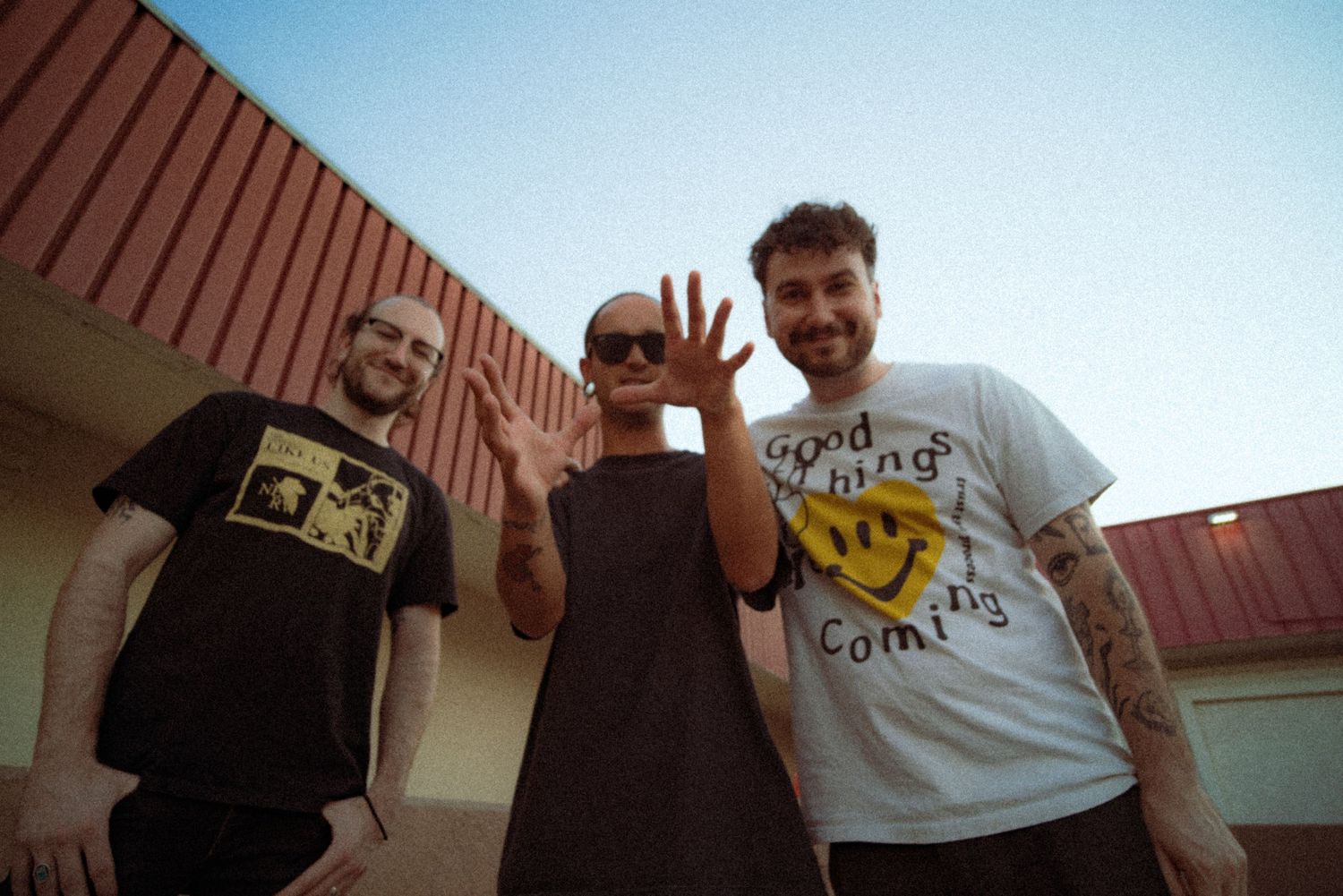 Troubled Minds band poses for the camera in Tempe, AZ in the daylight.