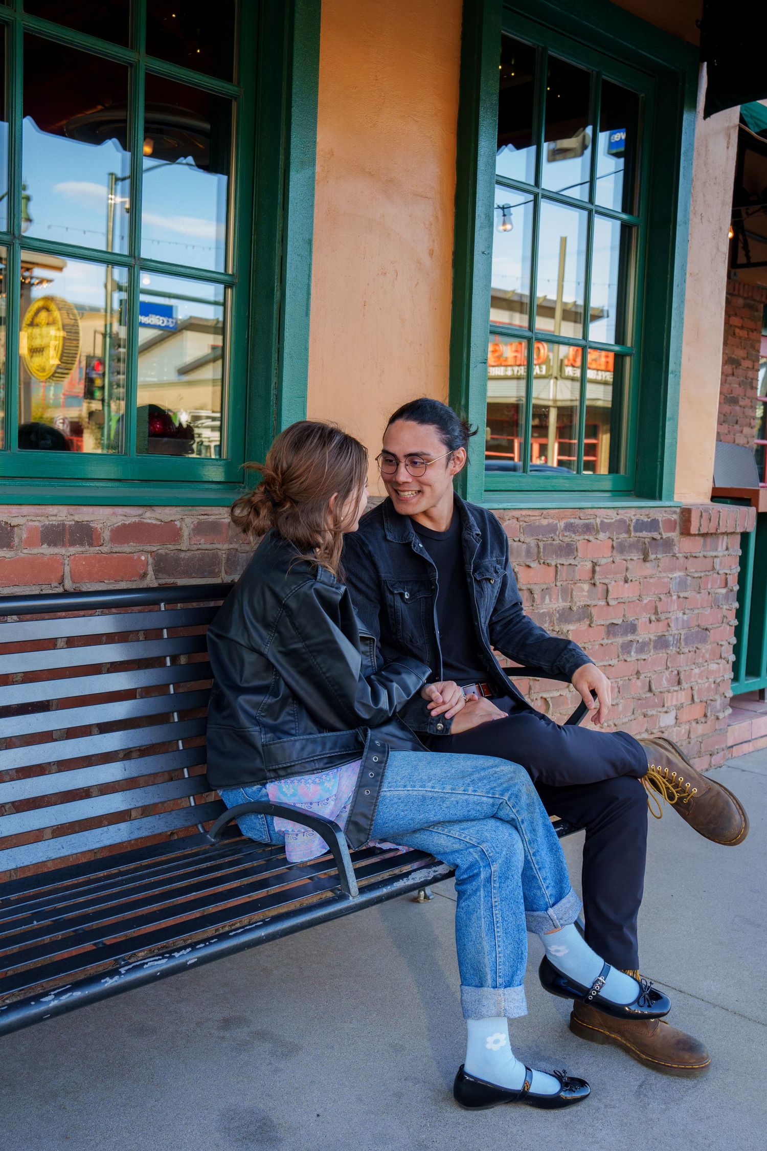 A series of photos taken on a wooden bench outside a building with green trim.