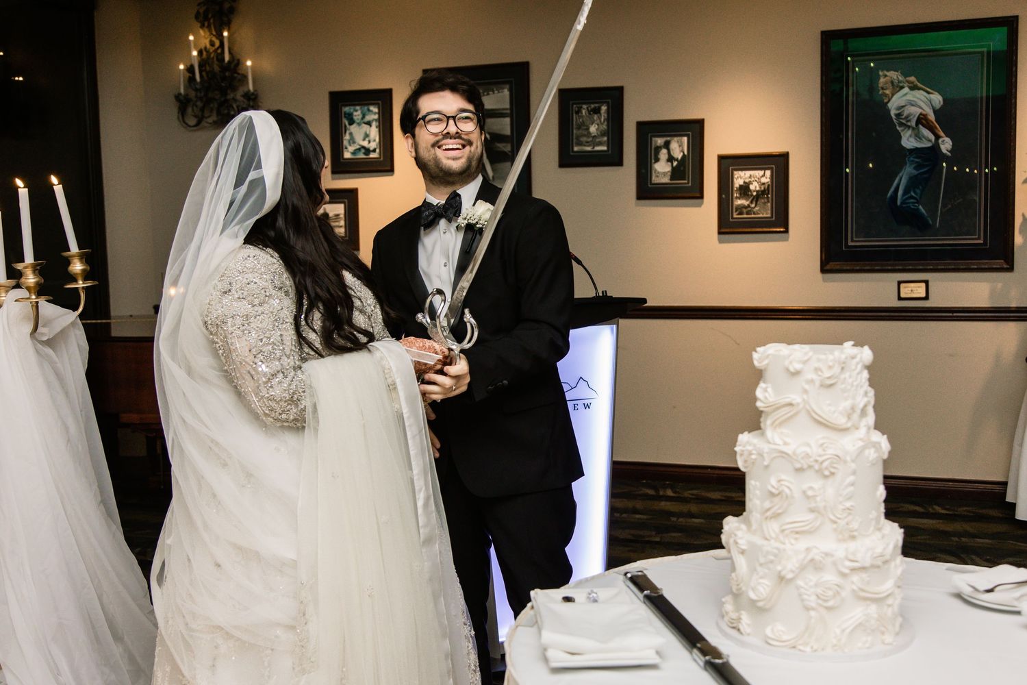 muslim Bride and groom cutting wedding cake at Nikah reception, indoor venue Vancouver