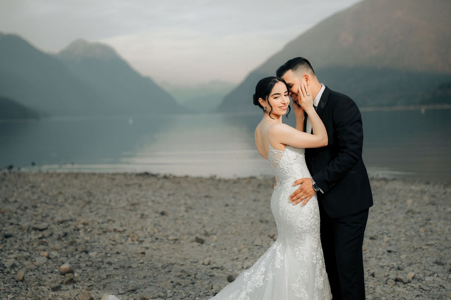 Couple embracing during engagement photoshoot at mountain lake, Vancouver photographer