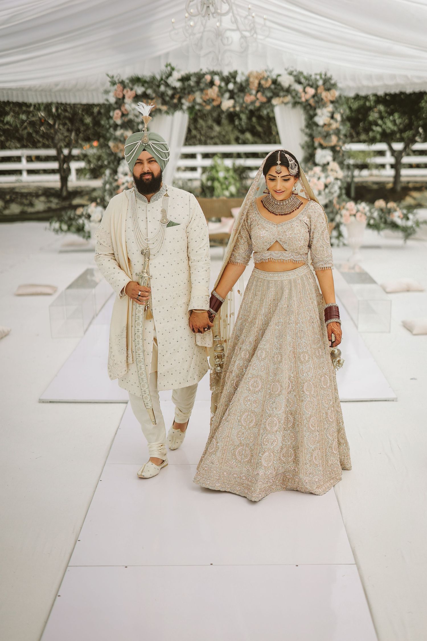 Bride and groom walking together at outdoor park wedding session