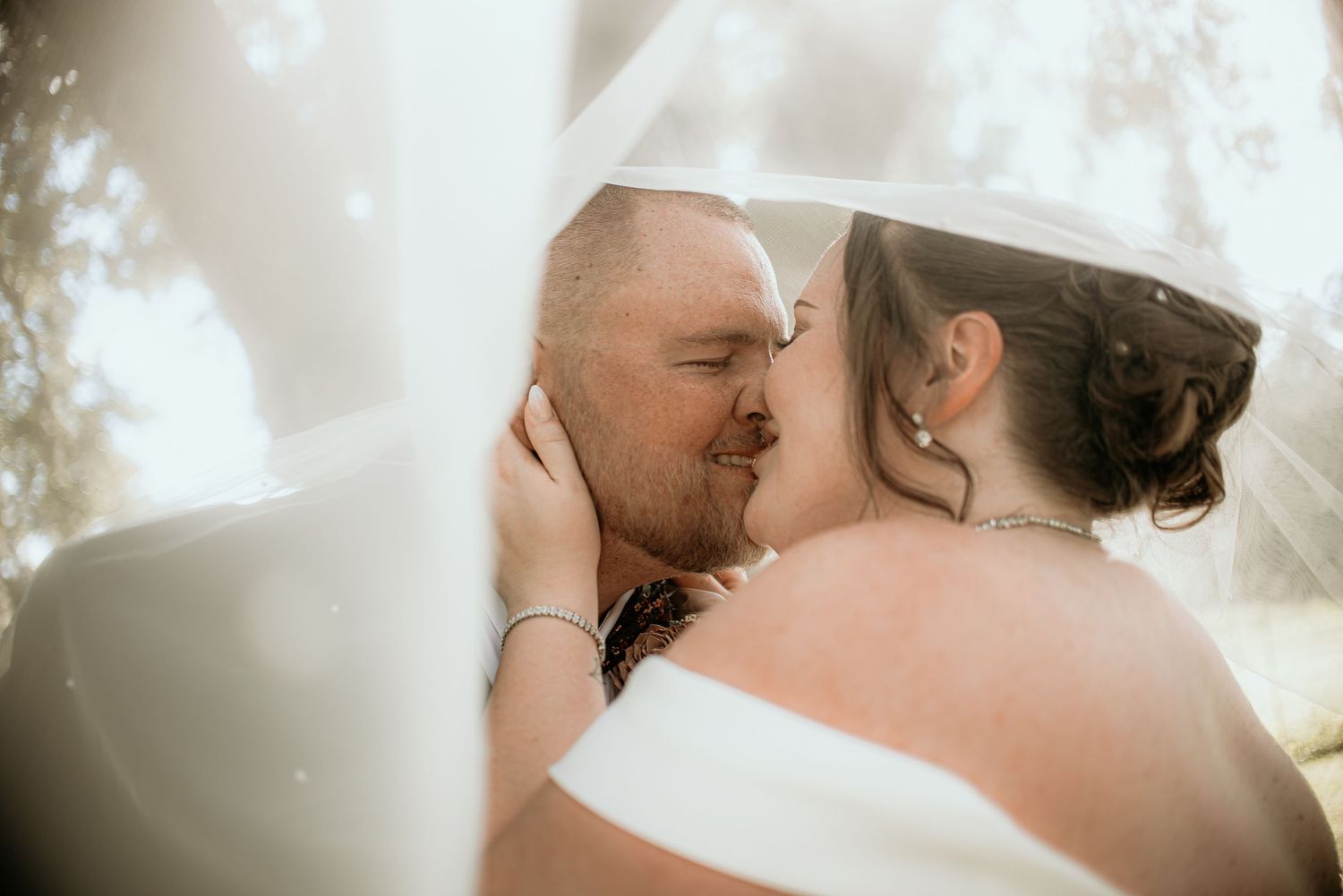 A romantic wedding couple shares intimate moments in a series of close-up shots.
