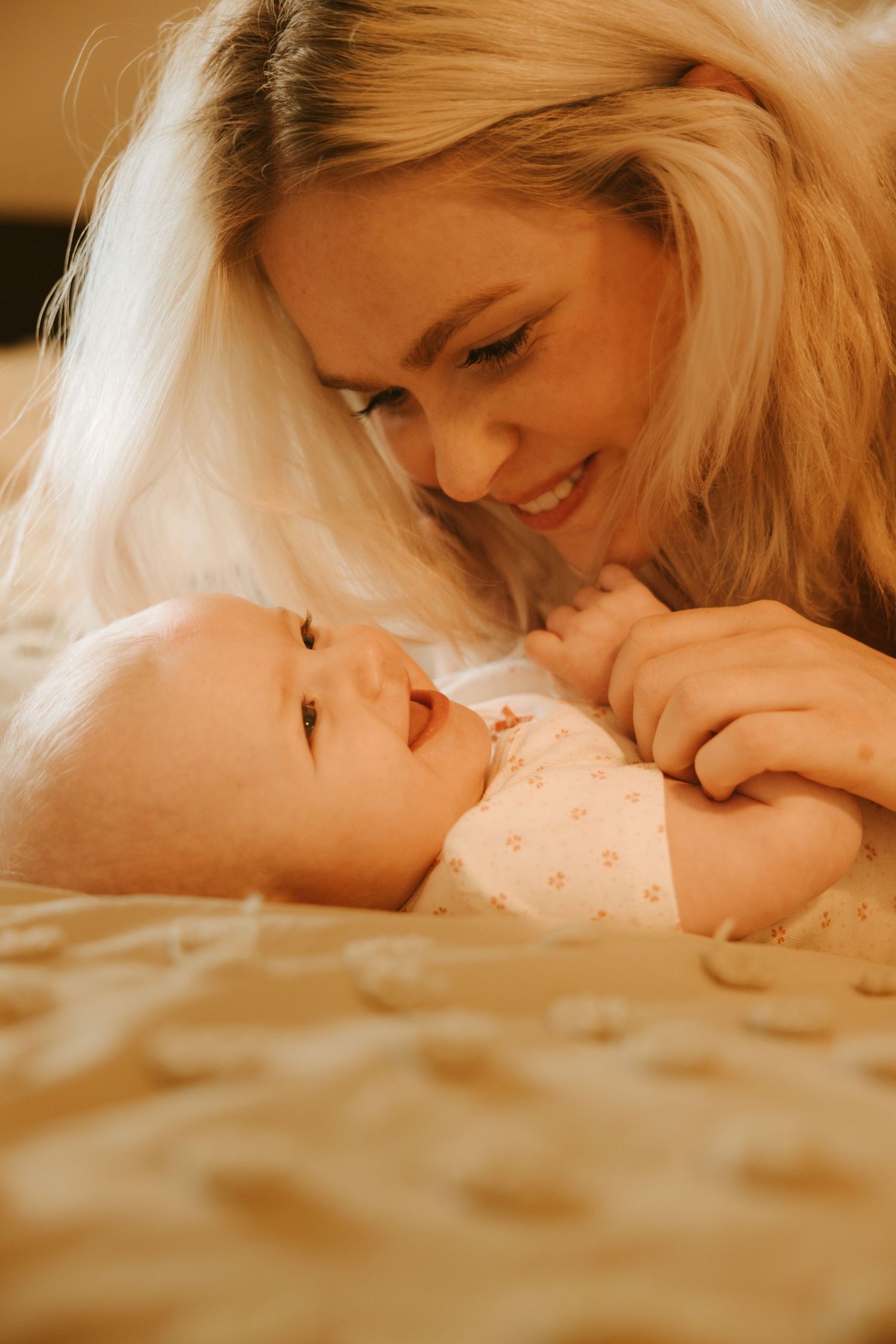 quiet in-home moment between a mother and her baby during a lifestyle photography session