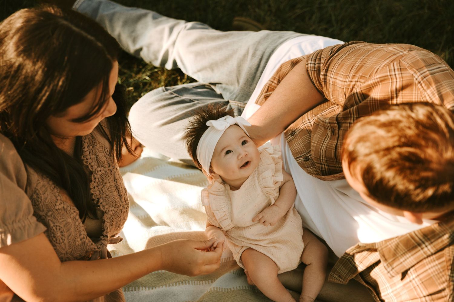 Parents gazing at their baby during a calm family photo session in Grovetown GA