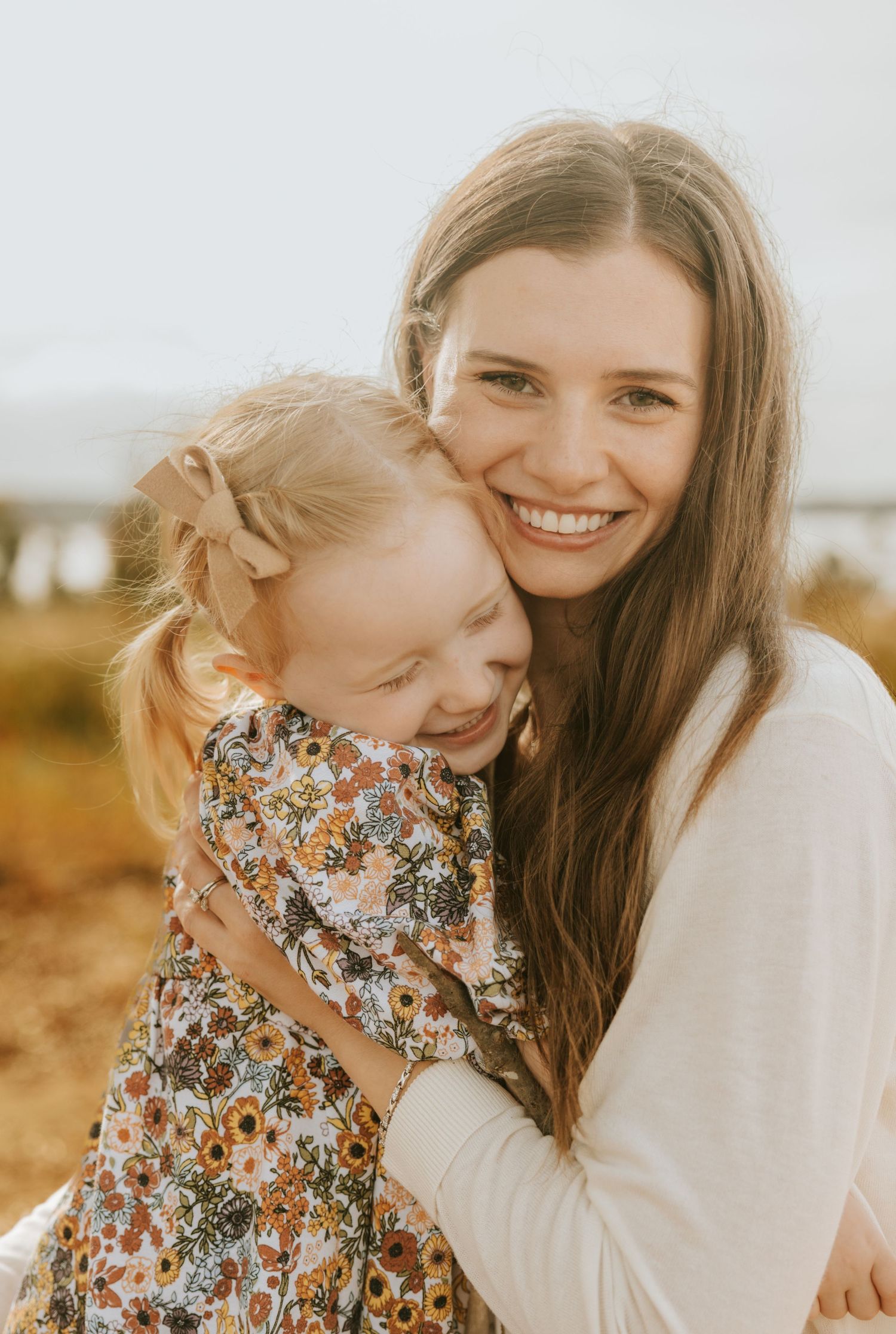 Lifestyle family photography capturing the bond between a mother and daughter outdoors in Evans GA
