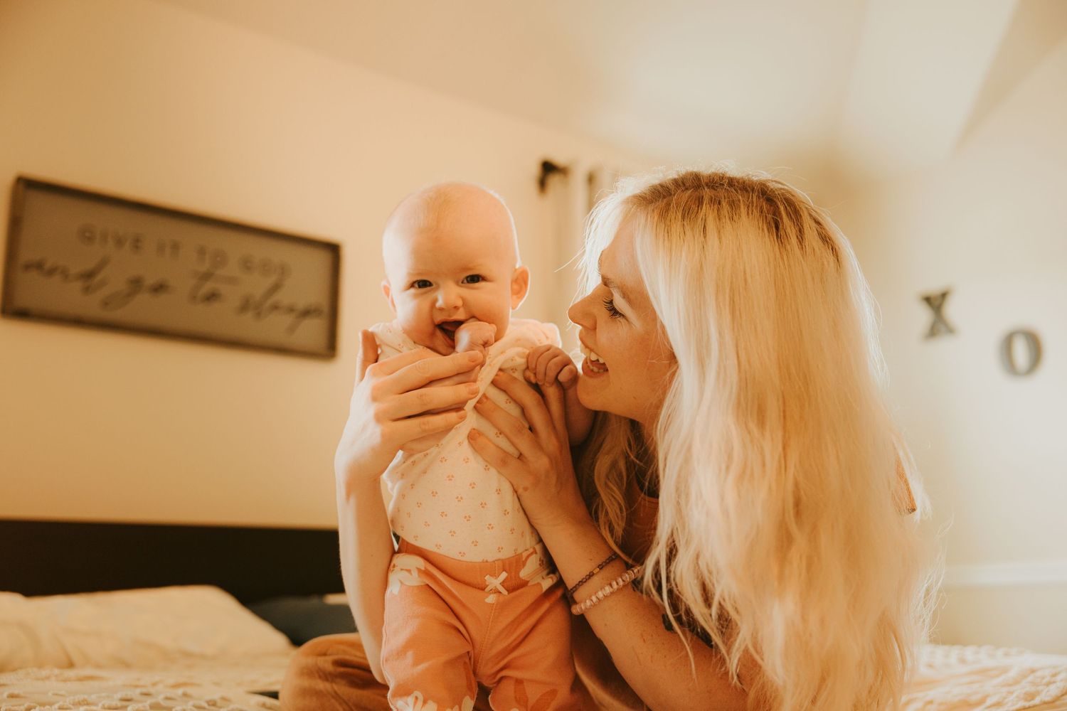 Intimate family photography showing mommy with her baby at home in Savannah GA